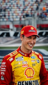 Nascar driver joey logano smiles on the track