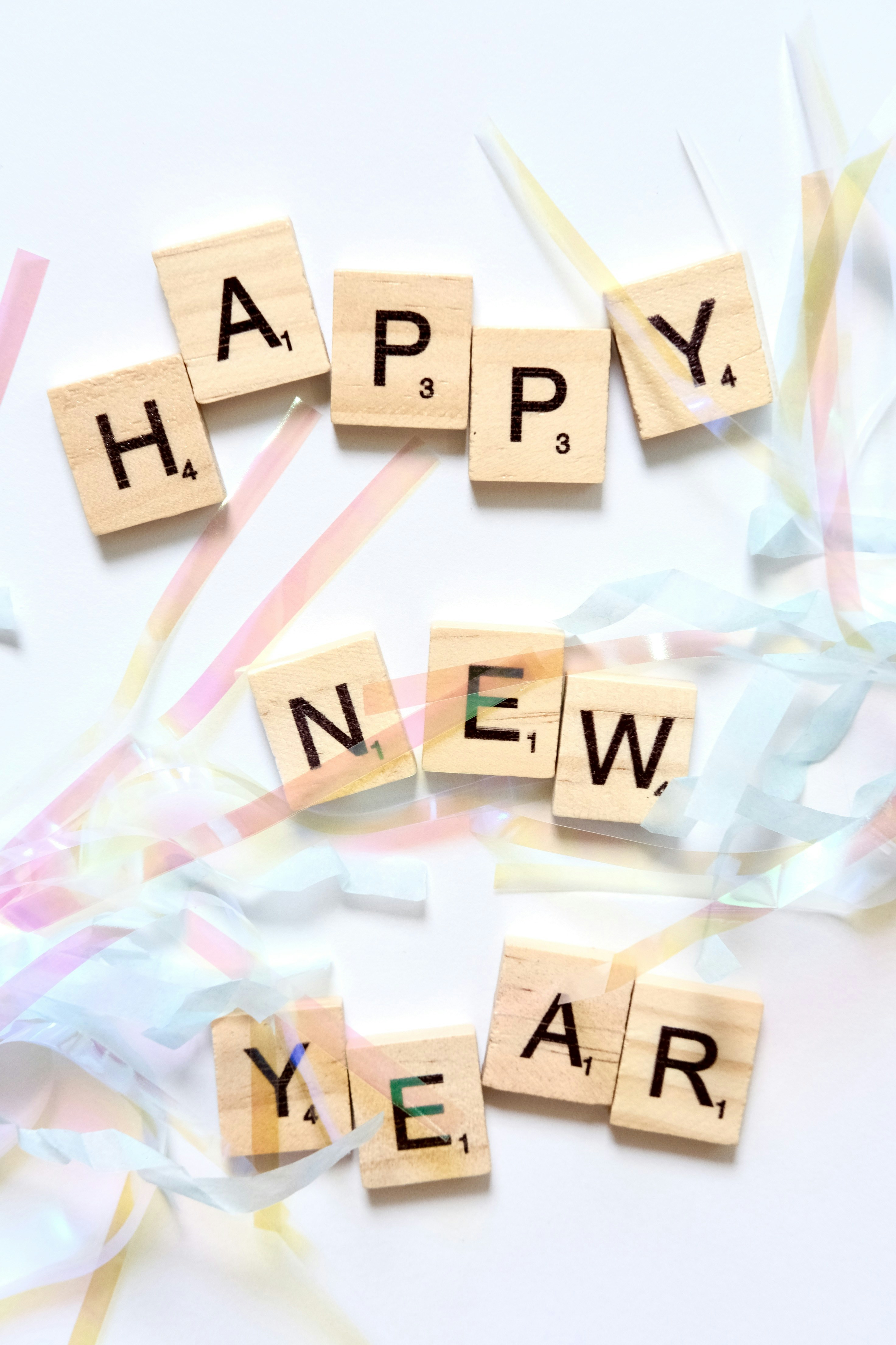 scrabble letters spelling 'happy new year'