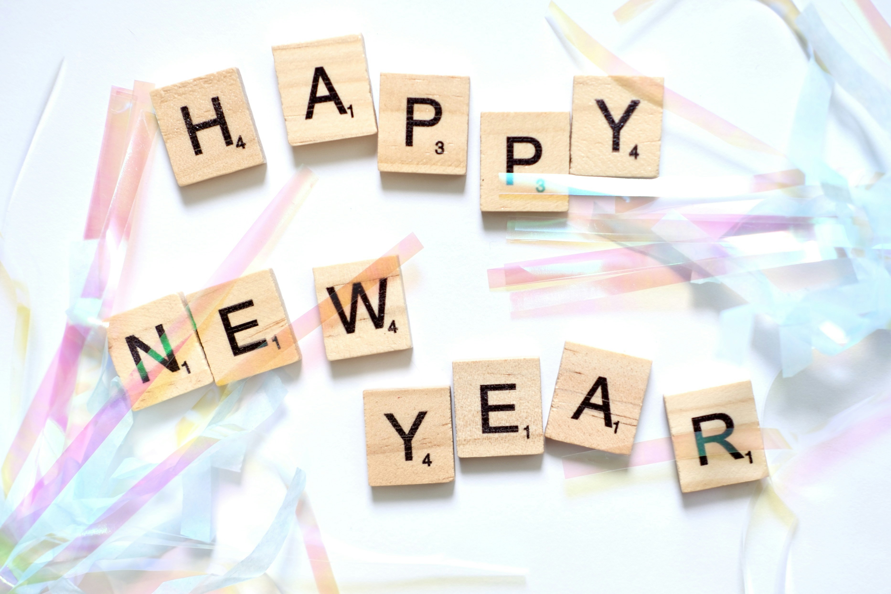 Happy new year spelled with scrabble tiles