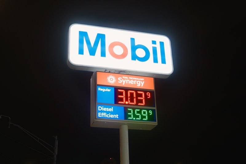 Mobil gas station sign with fuel prices at night