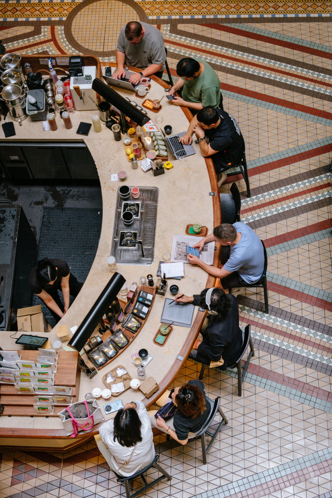 Guests and staff in a modern café