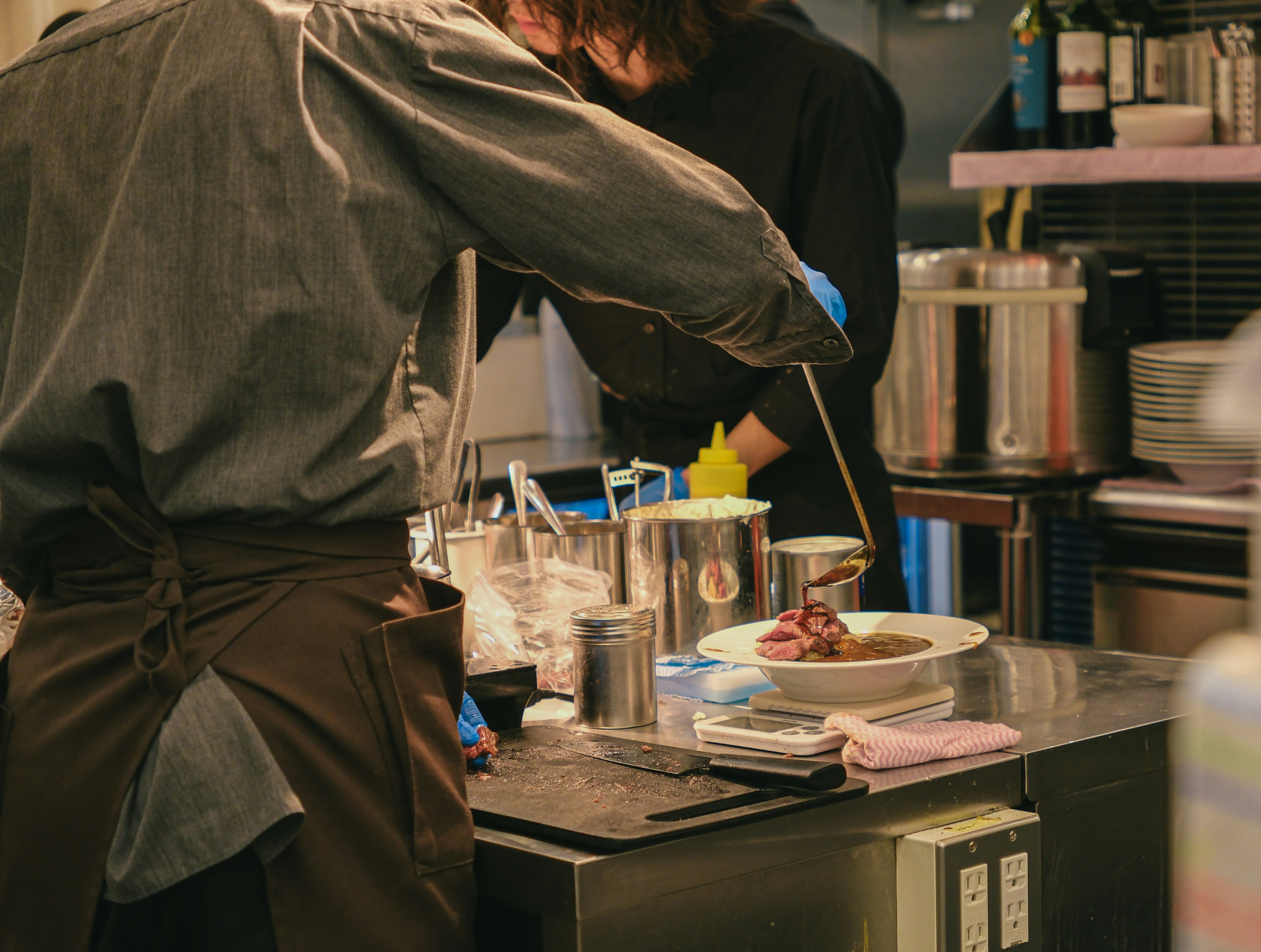 Chefs preparing food in restaurant kitchen