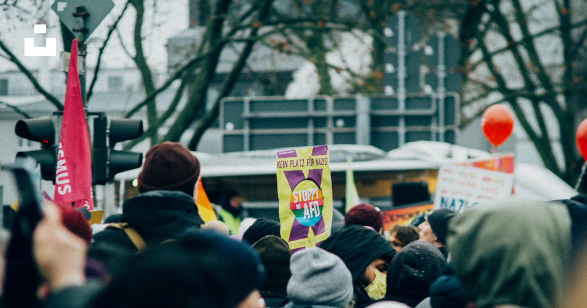 Random Crowd Signs Crowd holding signs at a protest or rally photo – Free Crowd Image on ...