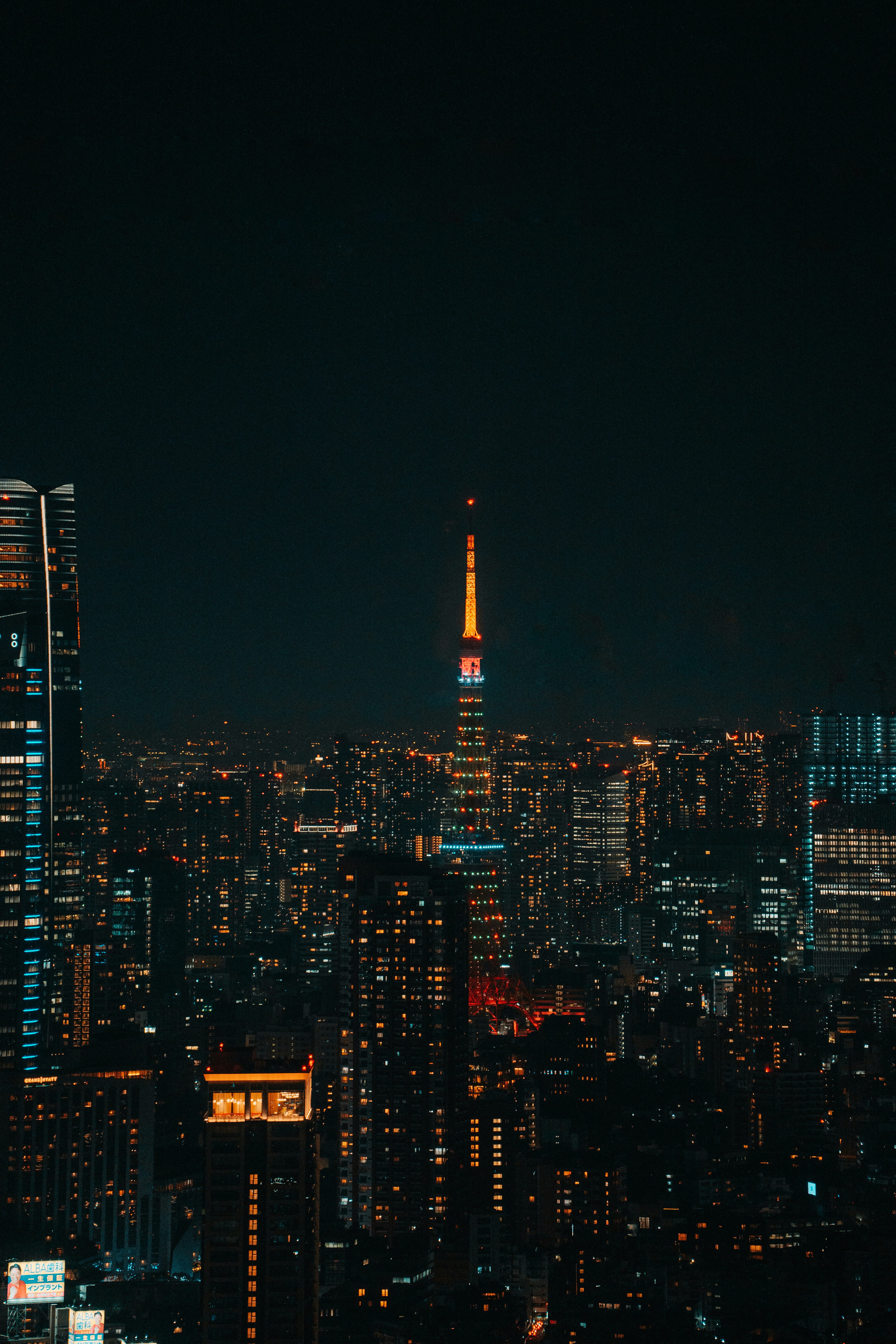 Vibrant cityscape with illuminated skyscrapers at night