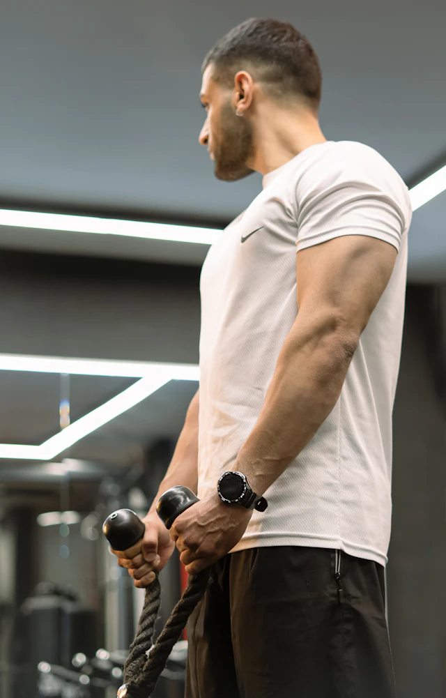 Man performing cable machine exercise