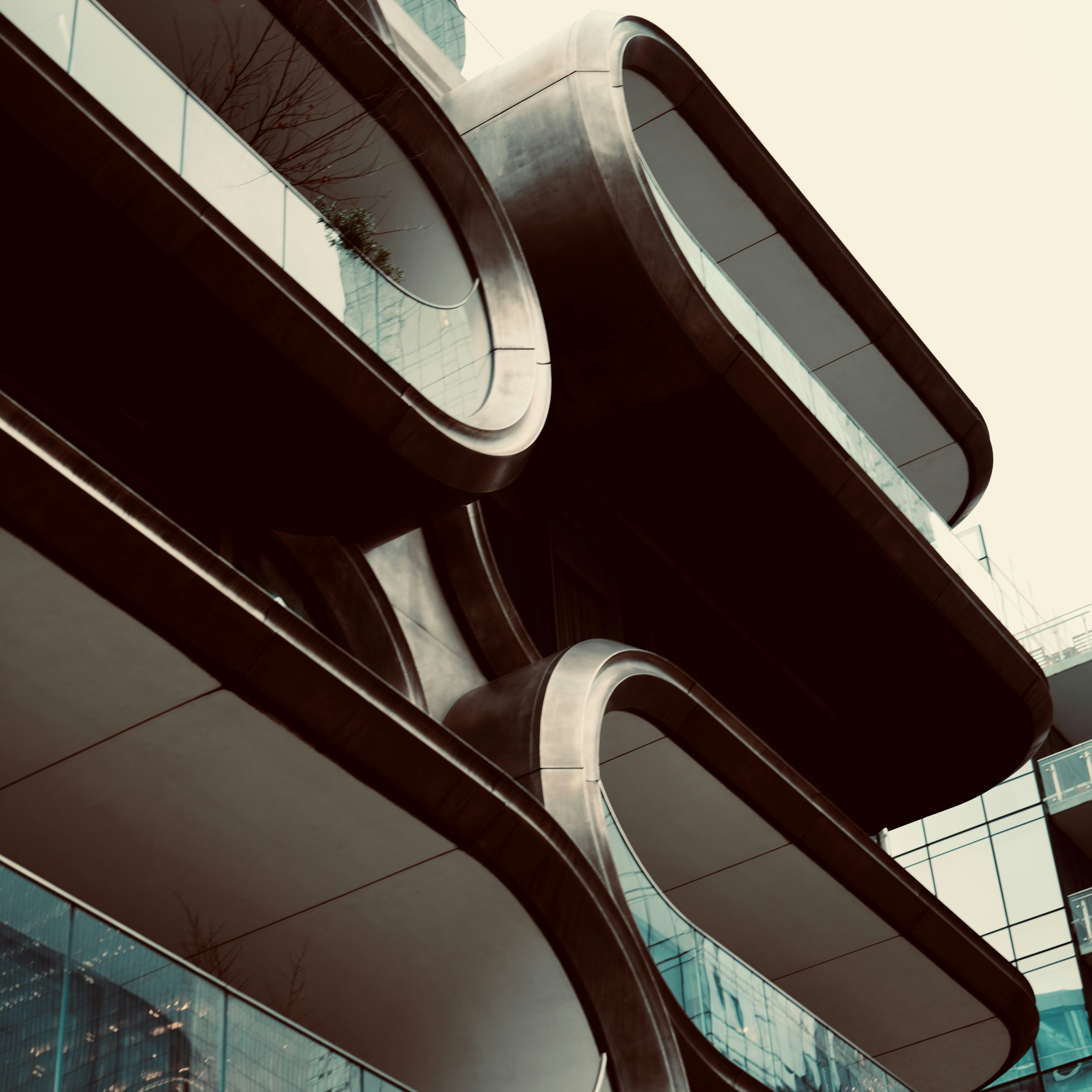 Modern building with curved balconies and glass windows