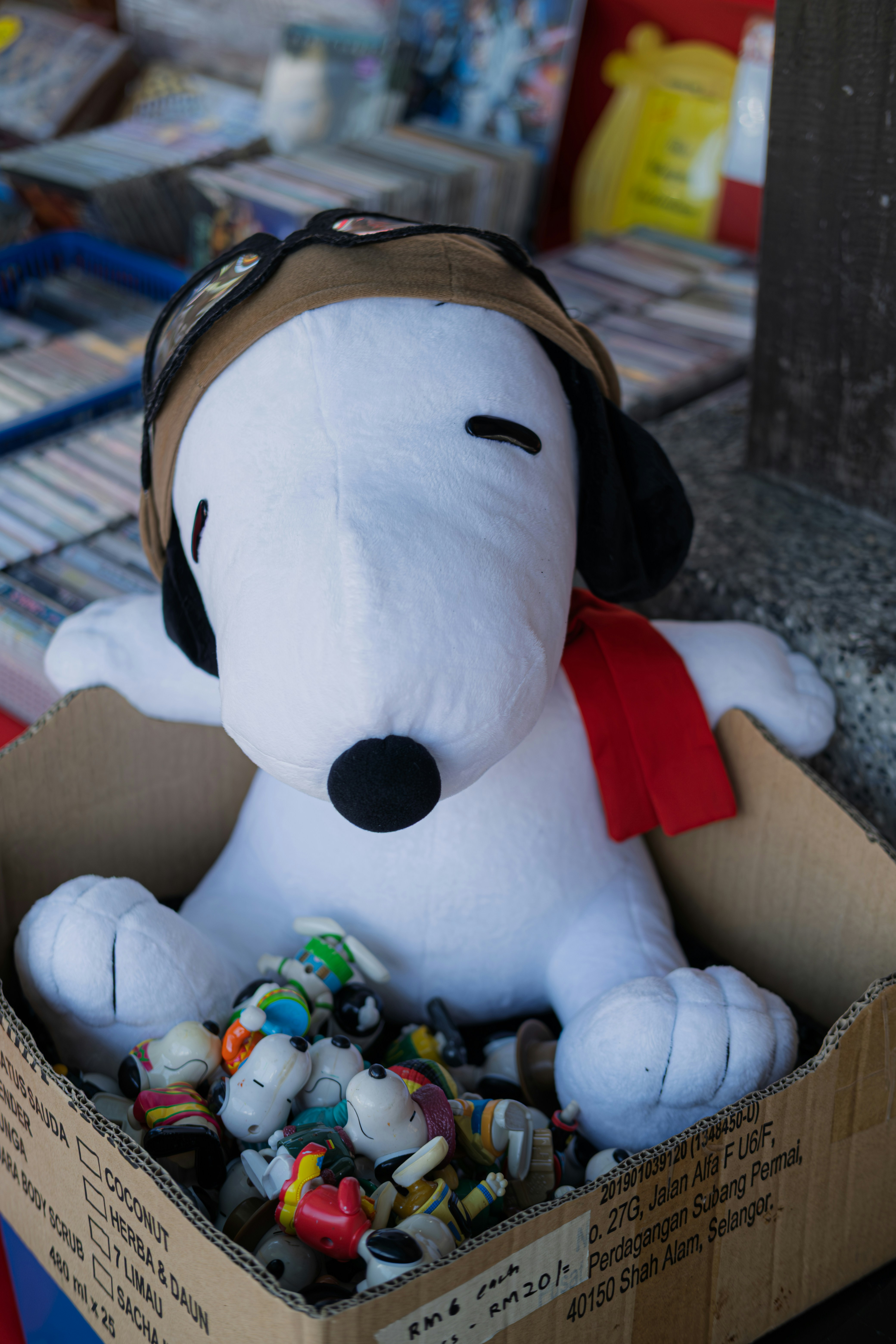 Snoopy plush toy with small figurines in box