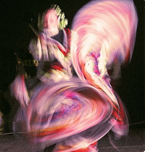 Dancer in colorful swirling motion blur