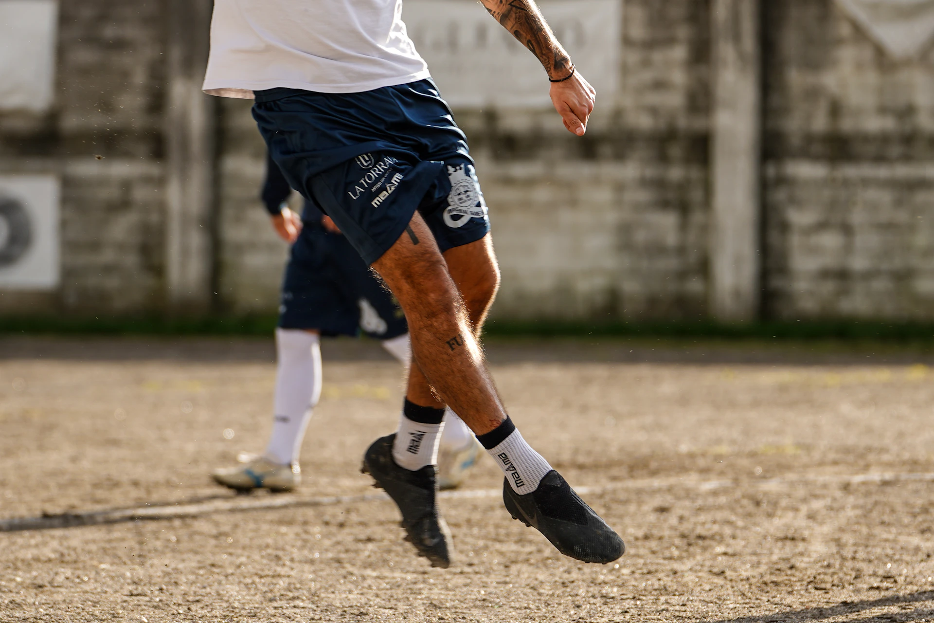 Soccer player jumping to head the ball