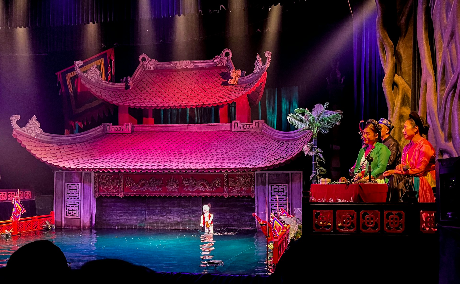Water puppet show with traditional stage and colorful stage.