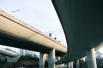 Modern concrete overpass structure against a clear sky