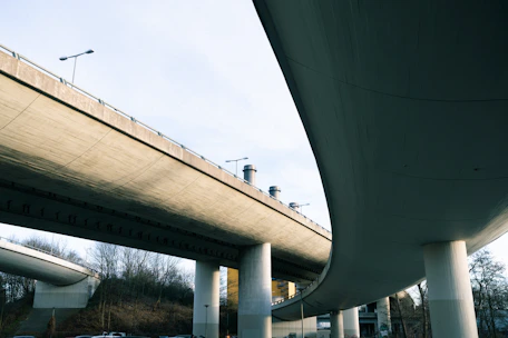Modern concrete overpass structure against a clear sky