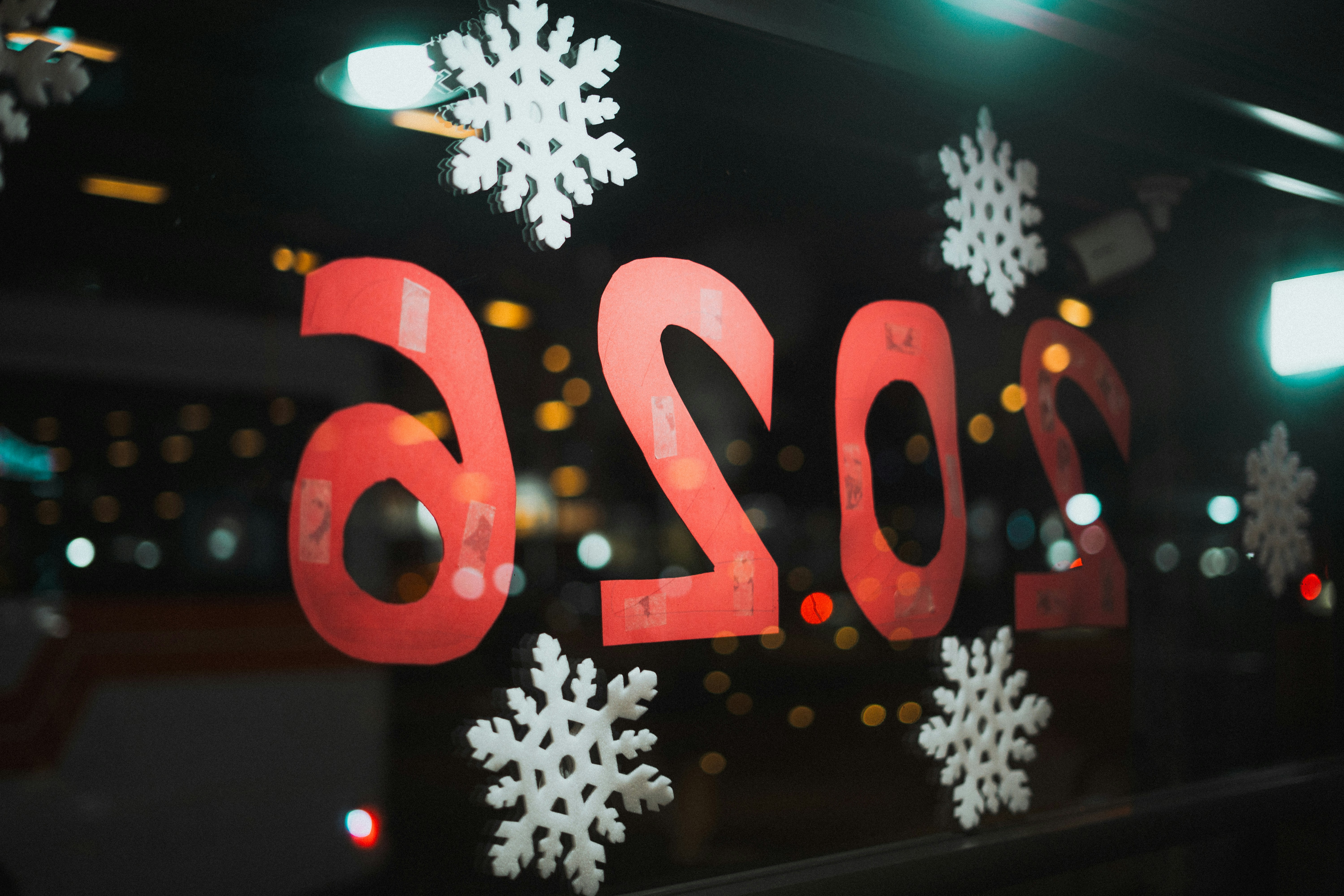 Red letters and snowflakes on a window