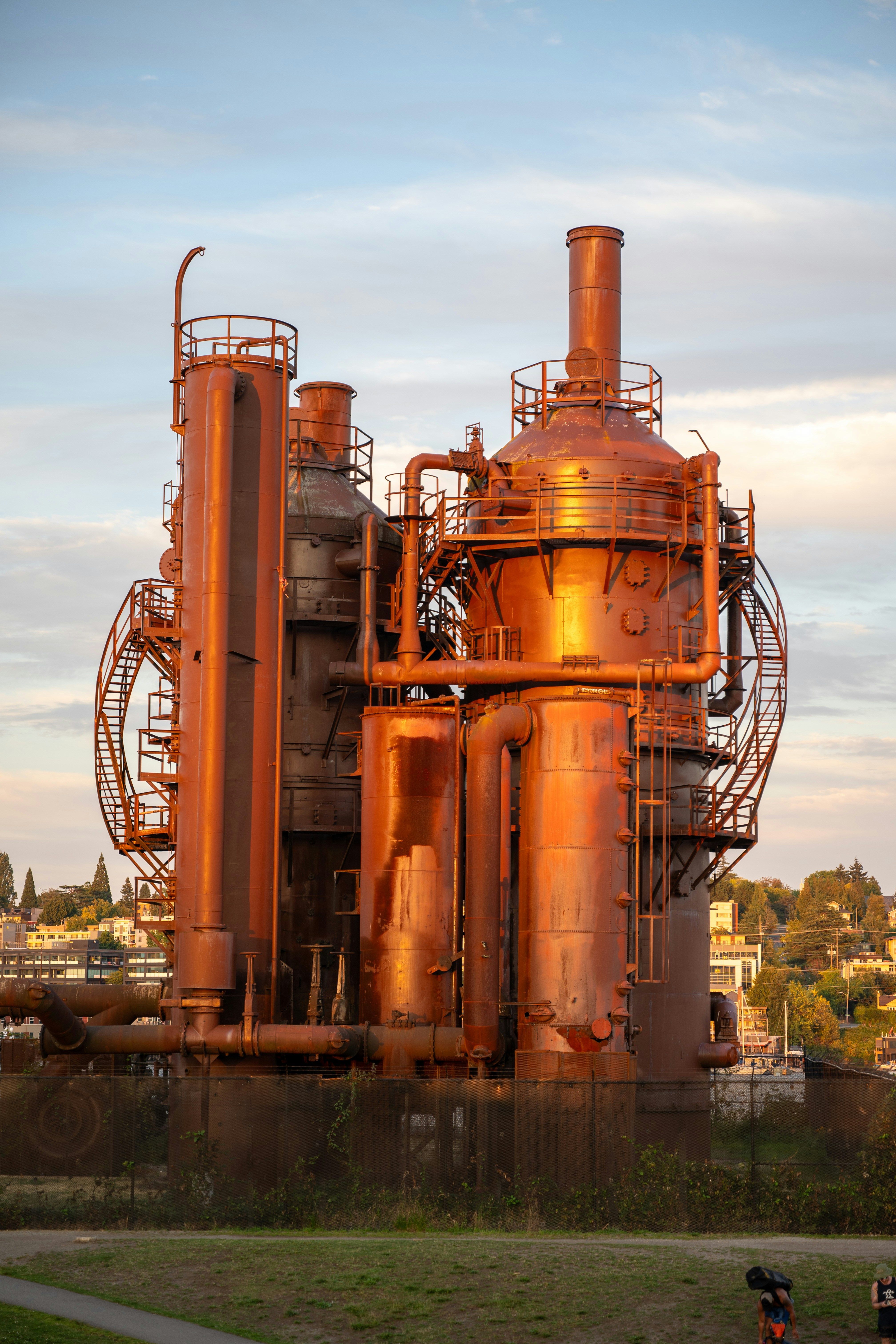 Old industrial gas works structure at sunset