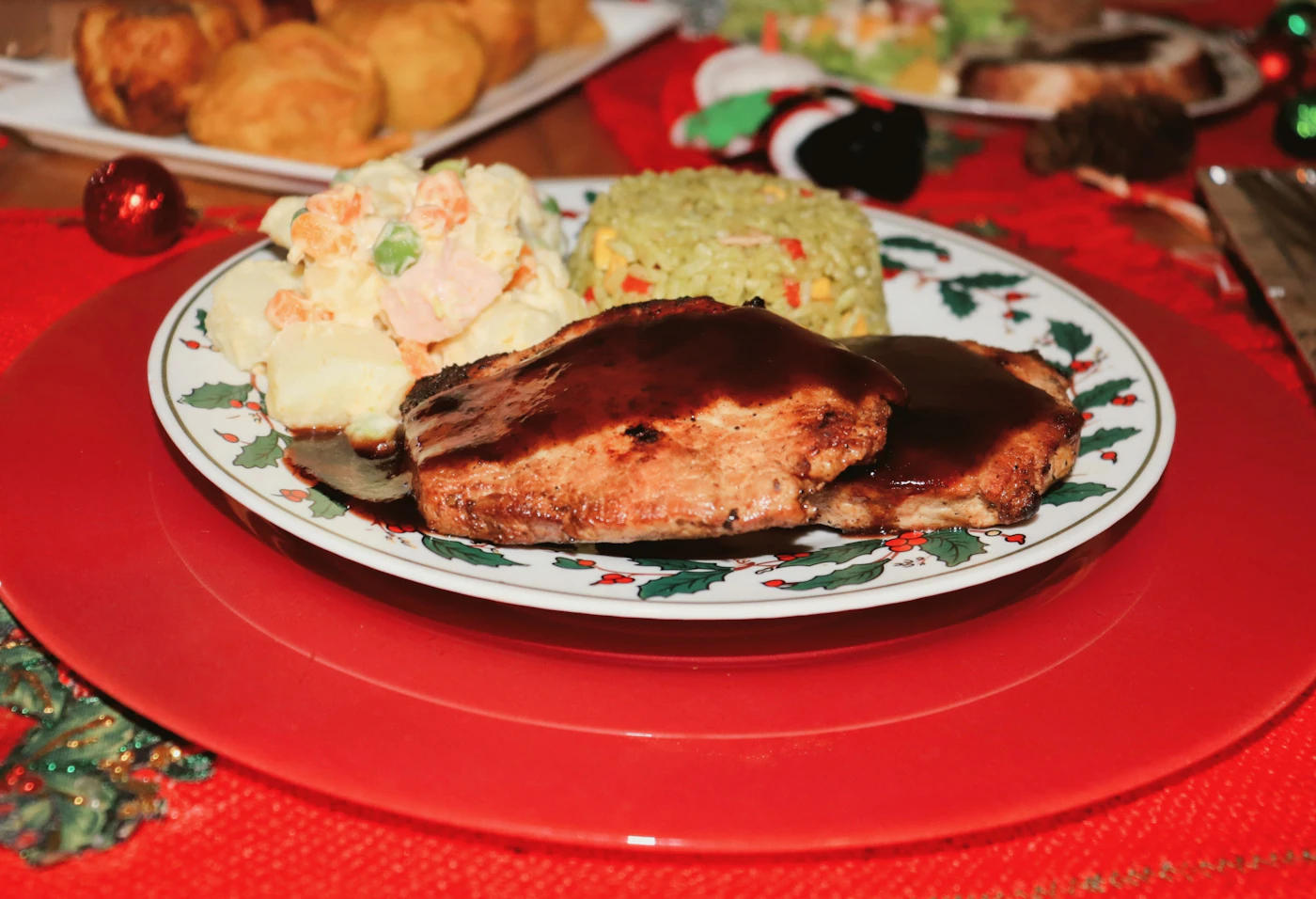 Glazed pork chops served with rice and a crisp cabbage salad