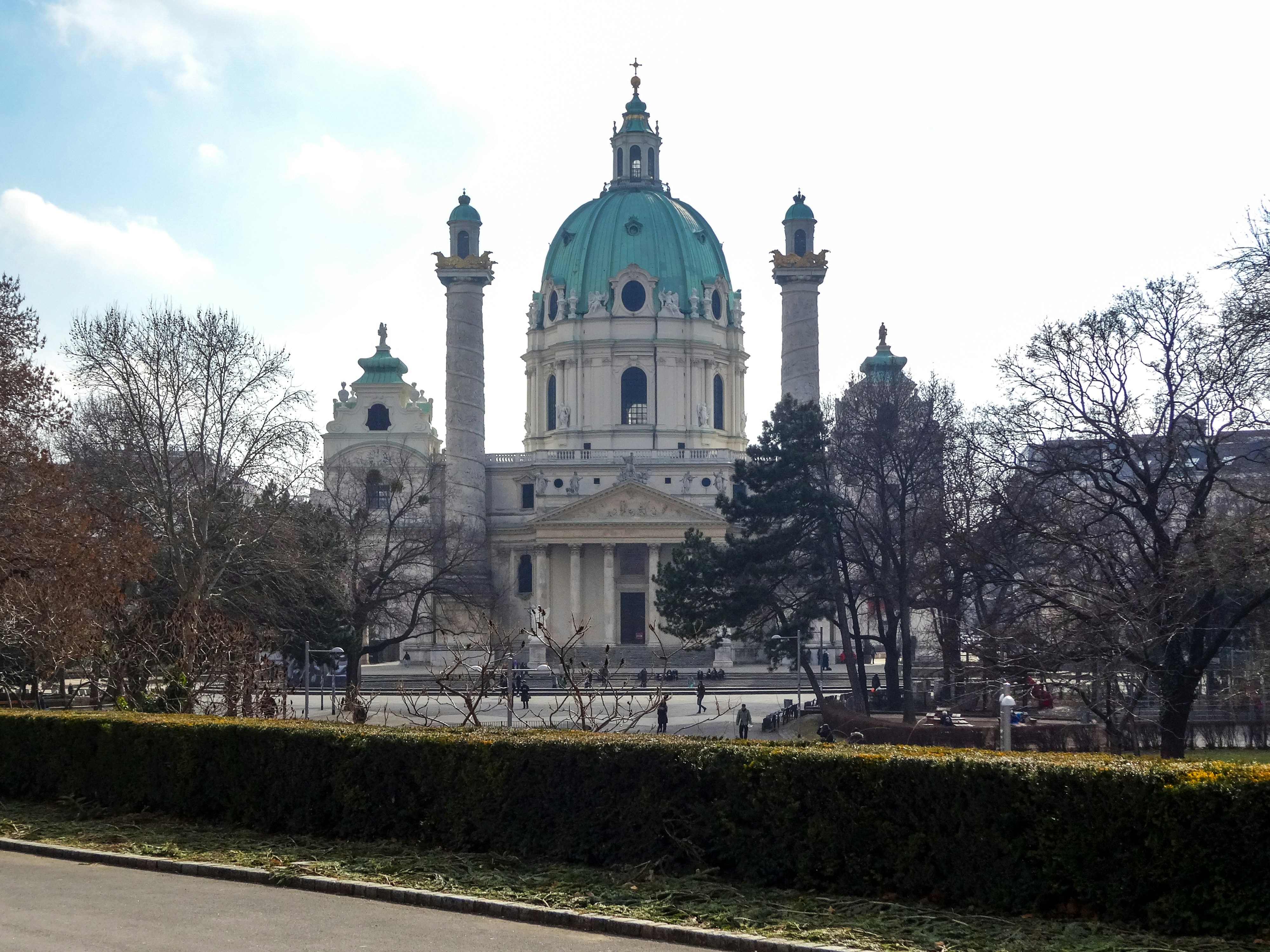 Karlskirche church in vienna with trees and sky