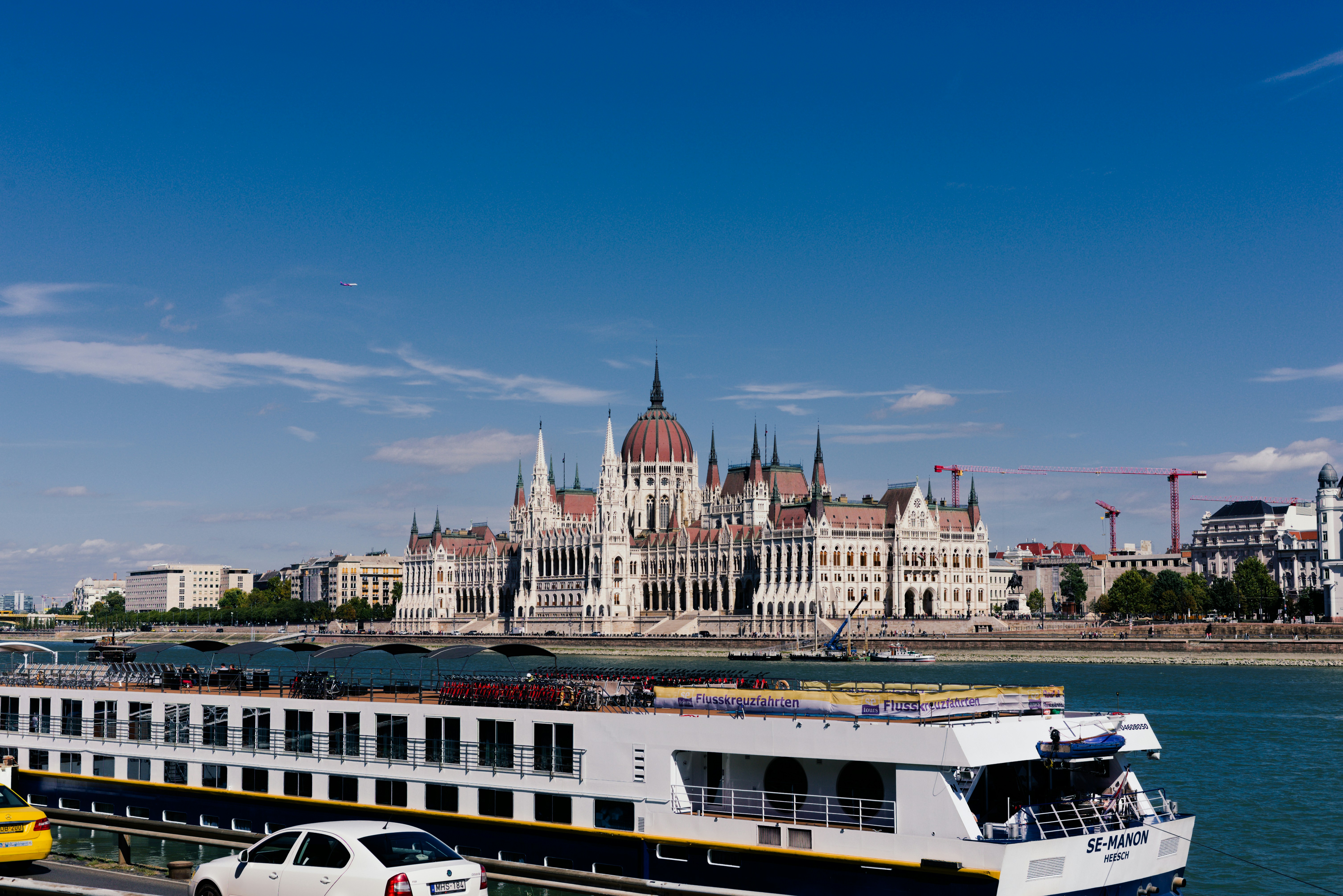 Cruise ship sailing past hungarian parliament building