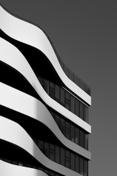 Modern building with curved white facade and windows