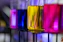 Colorful liquids in laboratory beakers on rack