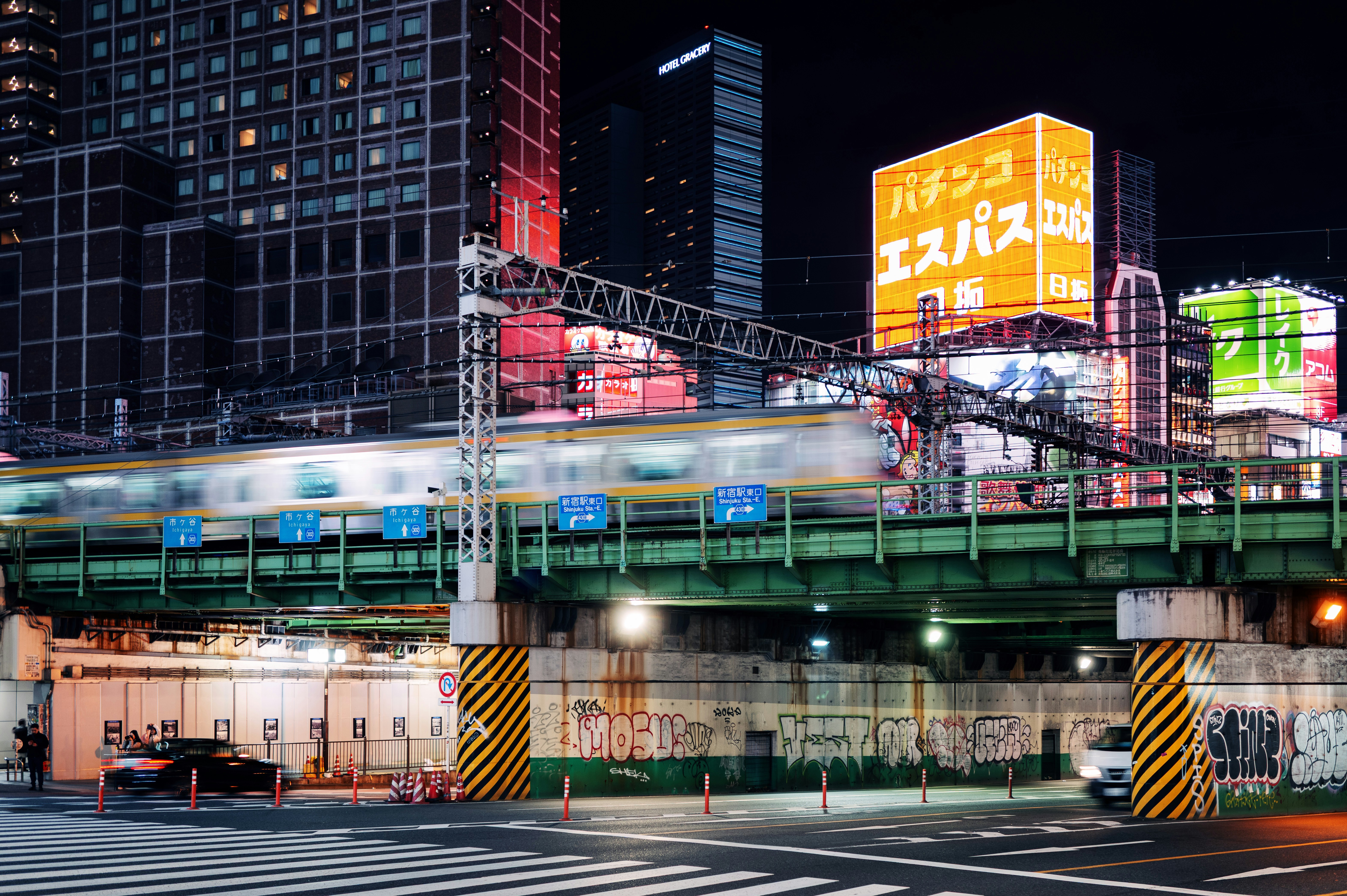 Train speeding through a city at night