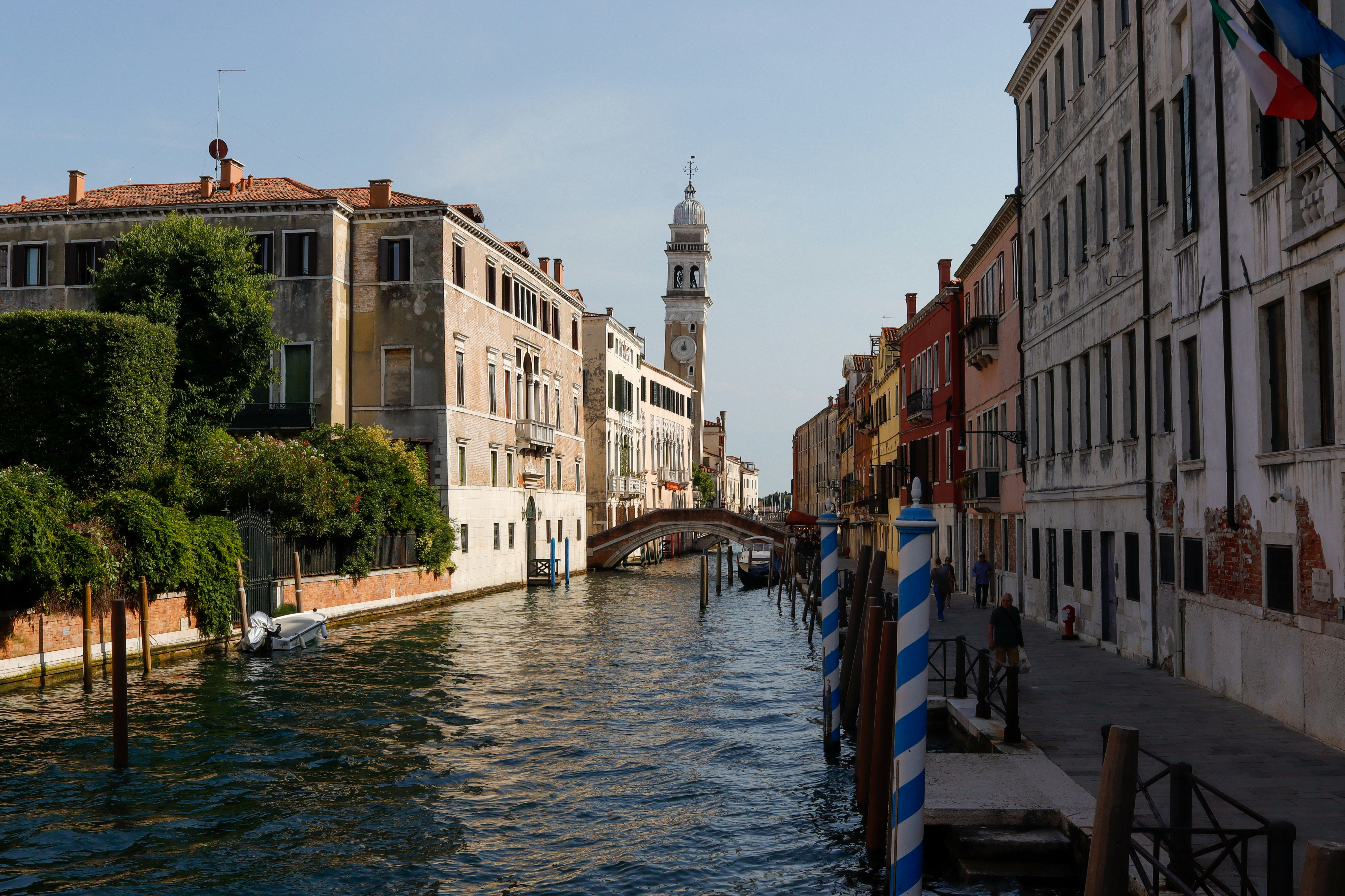 Venice canal with colorful buildings and bridge