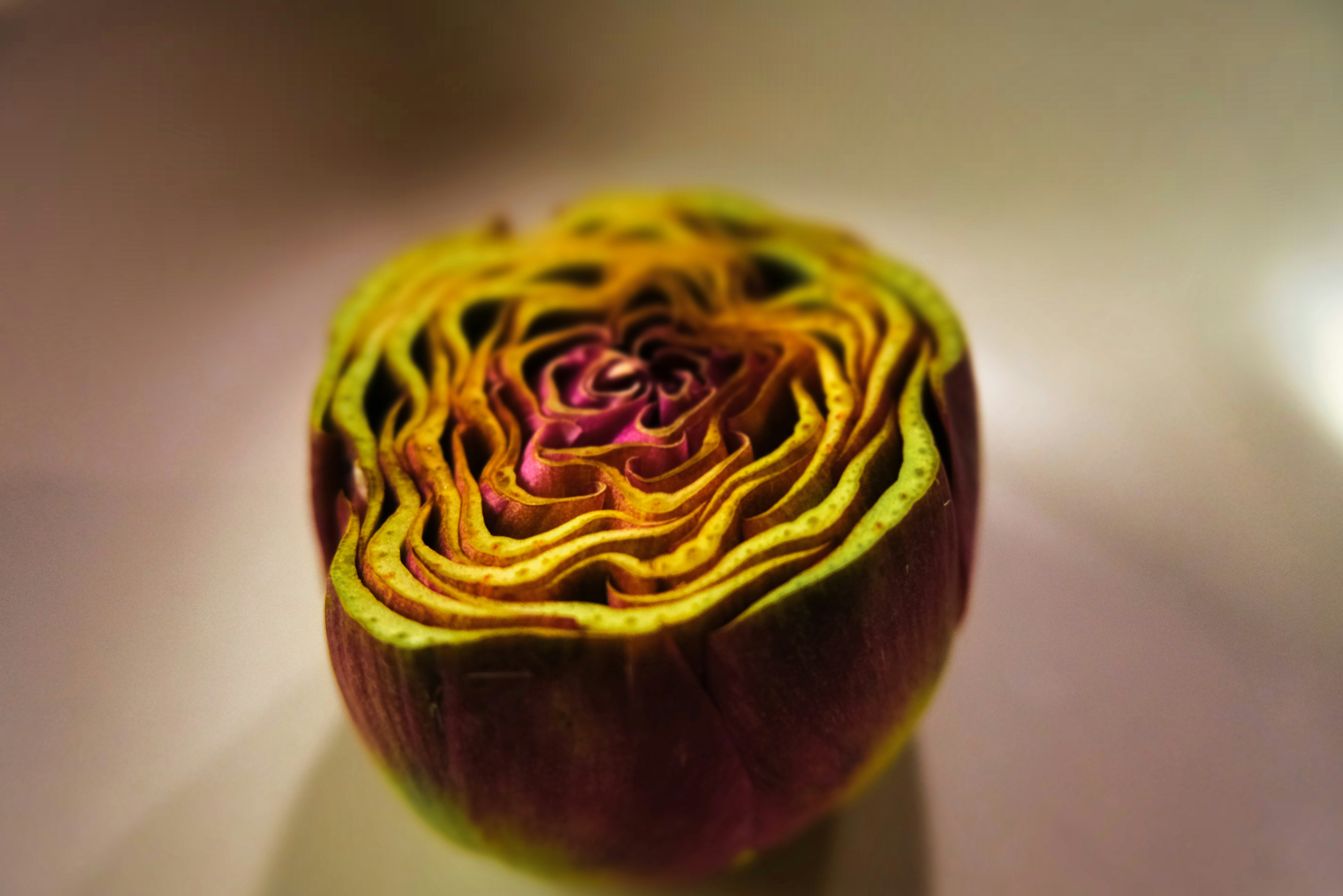 Close-up of a sliced artichoke with vibrant layers