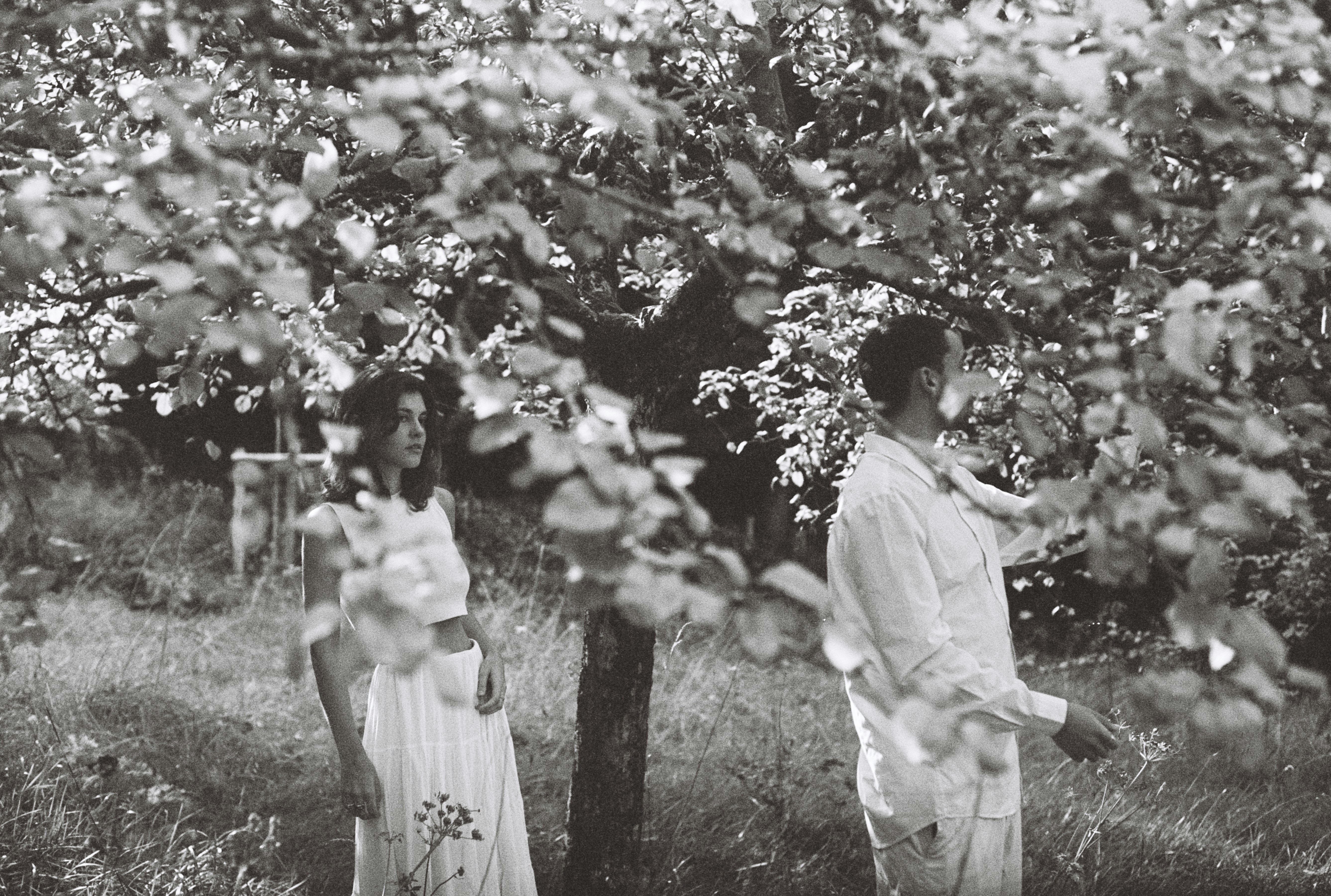 Couple in a garden with blooming trees