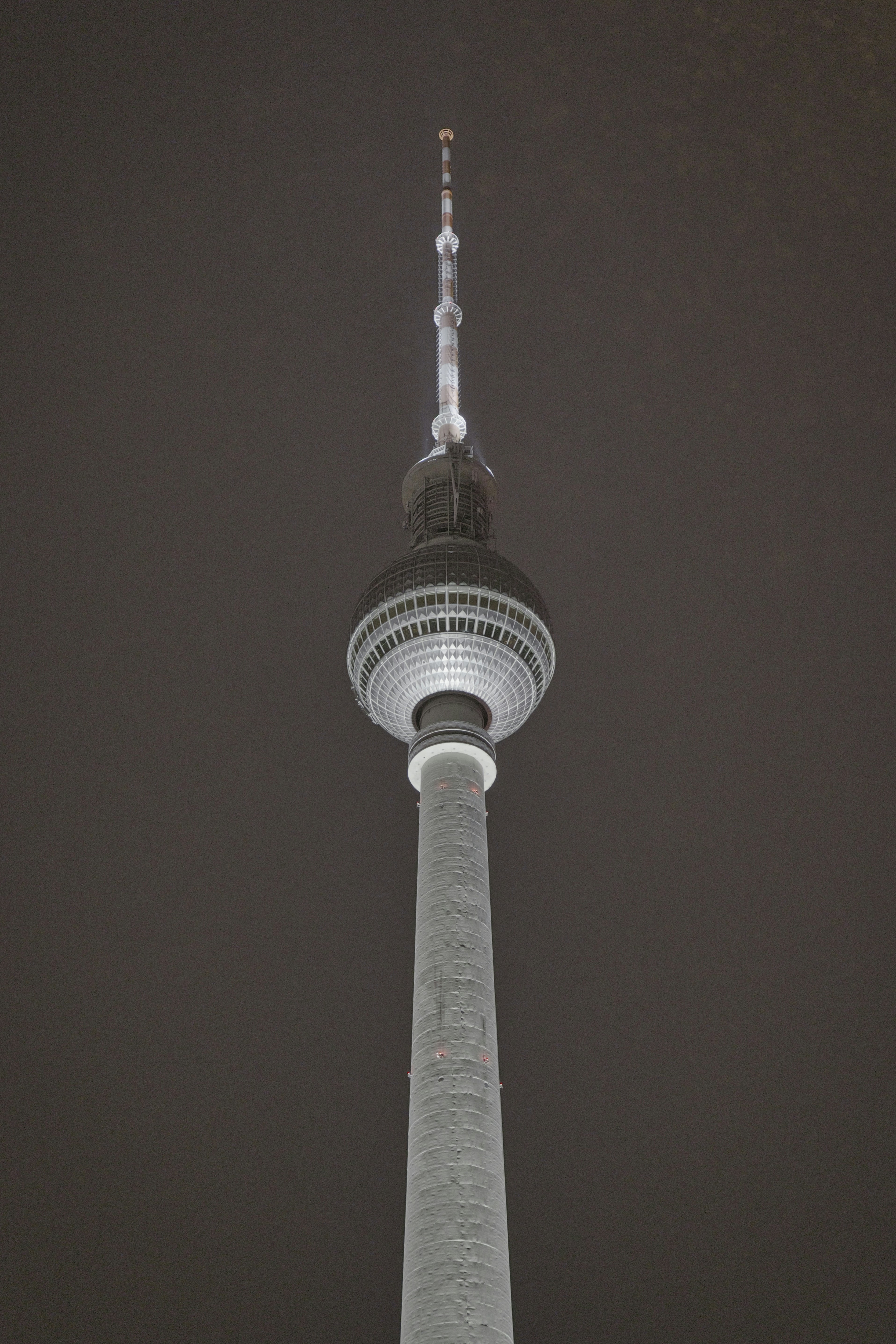 A tall tower against a dark sky - a-tall-tower-against-a-dark-sky-oGufOjvoRTQ