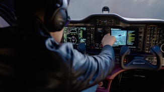 Pilot using touchscreen in airplane cockpit