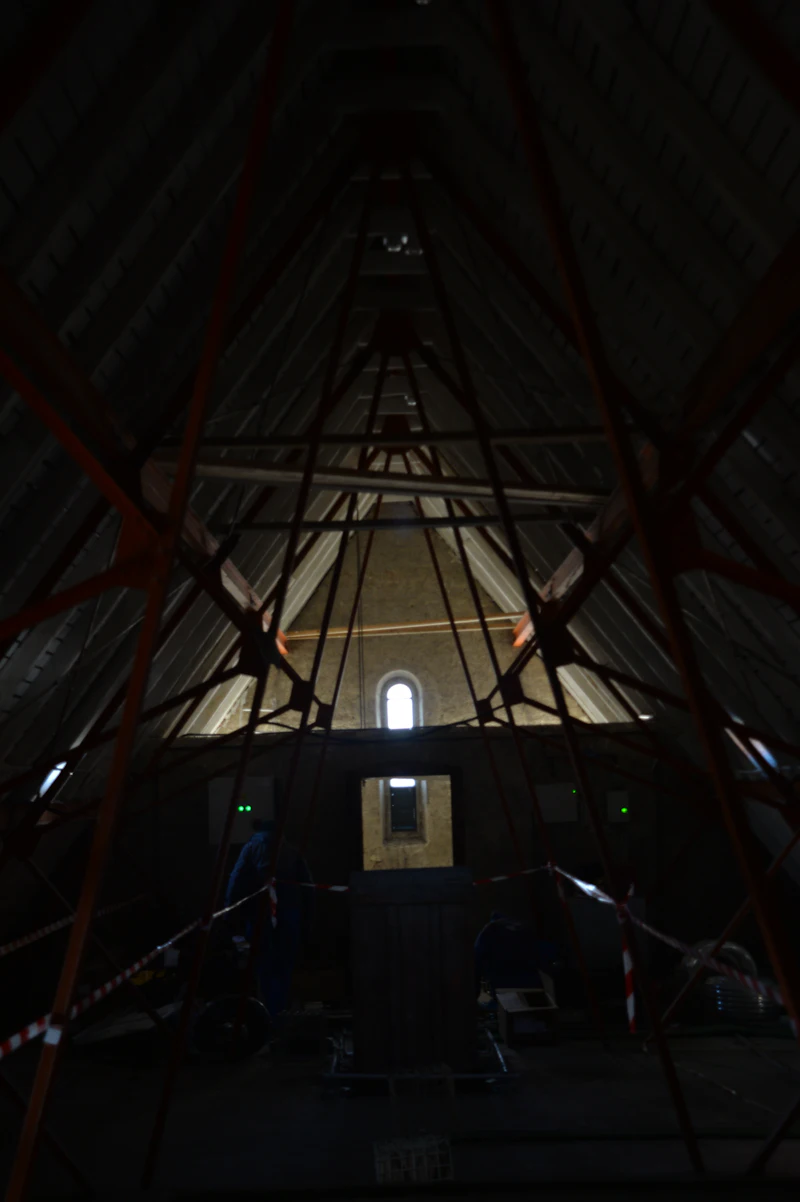 Attic with wooden beams before conversion