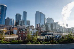 Modern city skyline with tall buildings under clear sky.