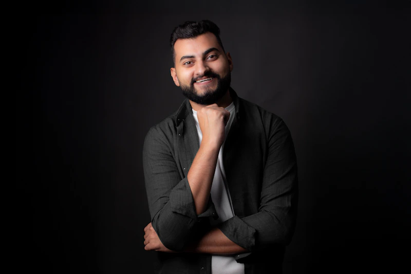 bearded man smiling with quiet confidence