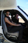 Two people in a small aircraft cockpit