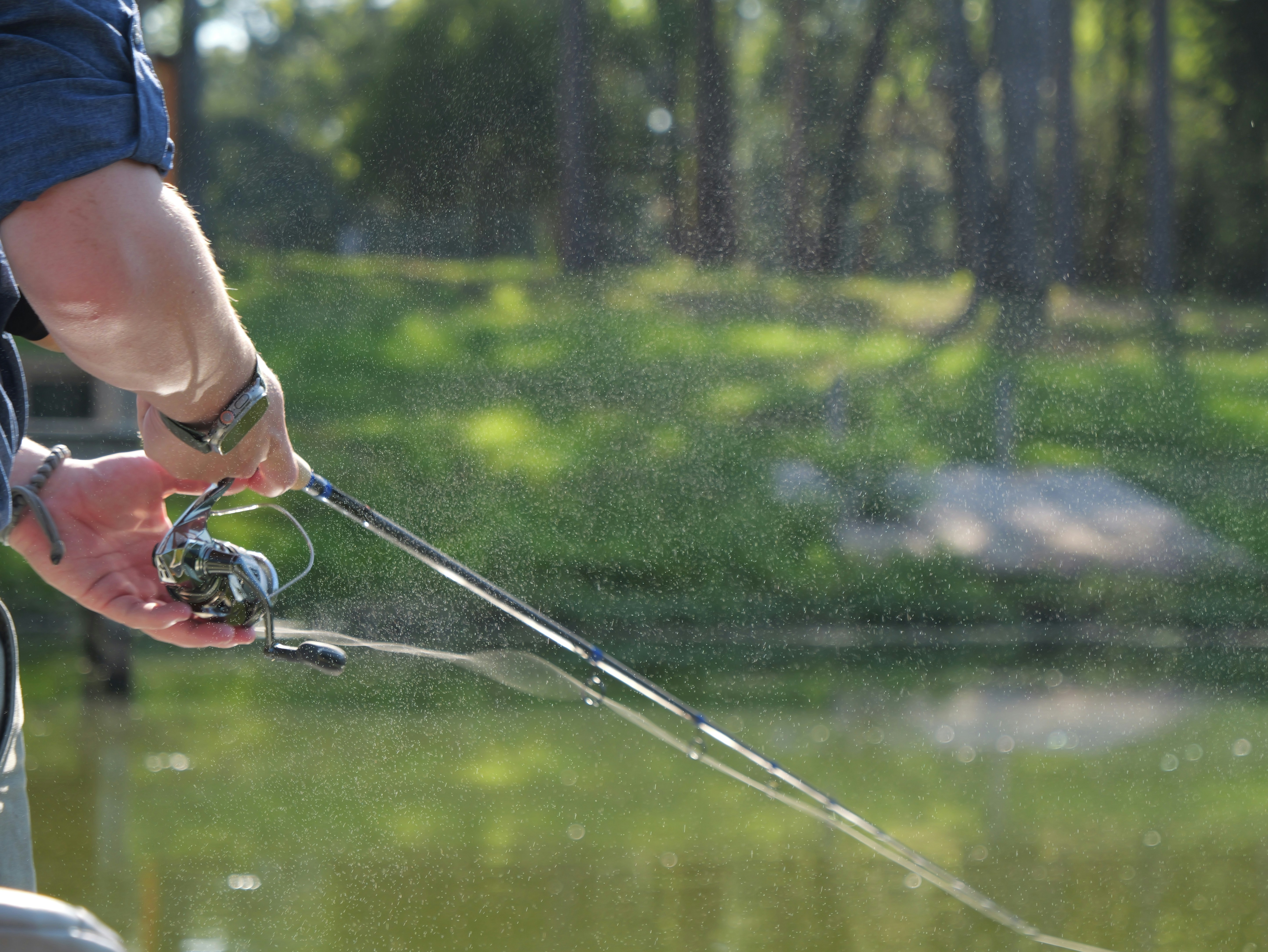 Person fishing with a rod and reel