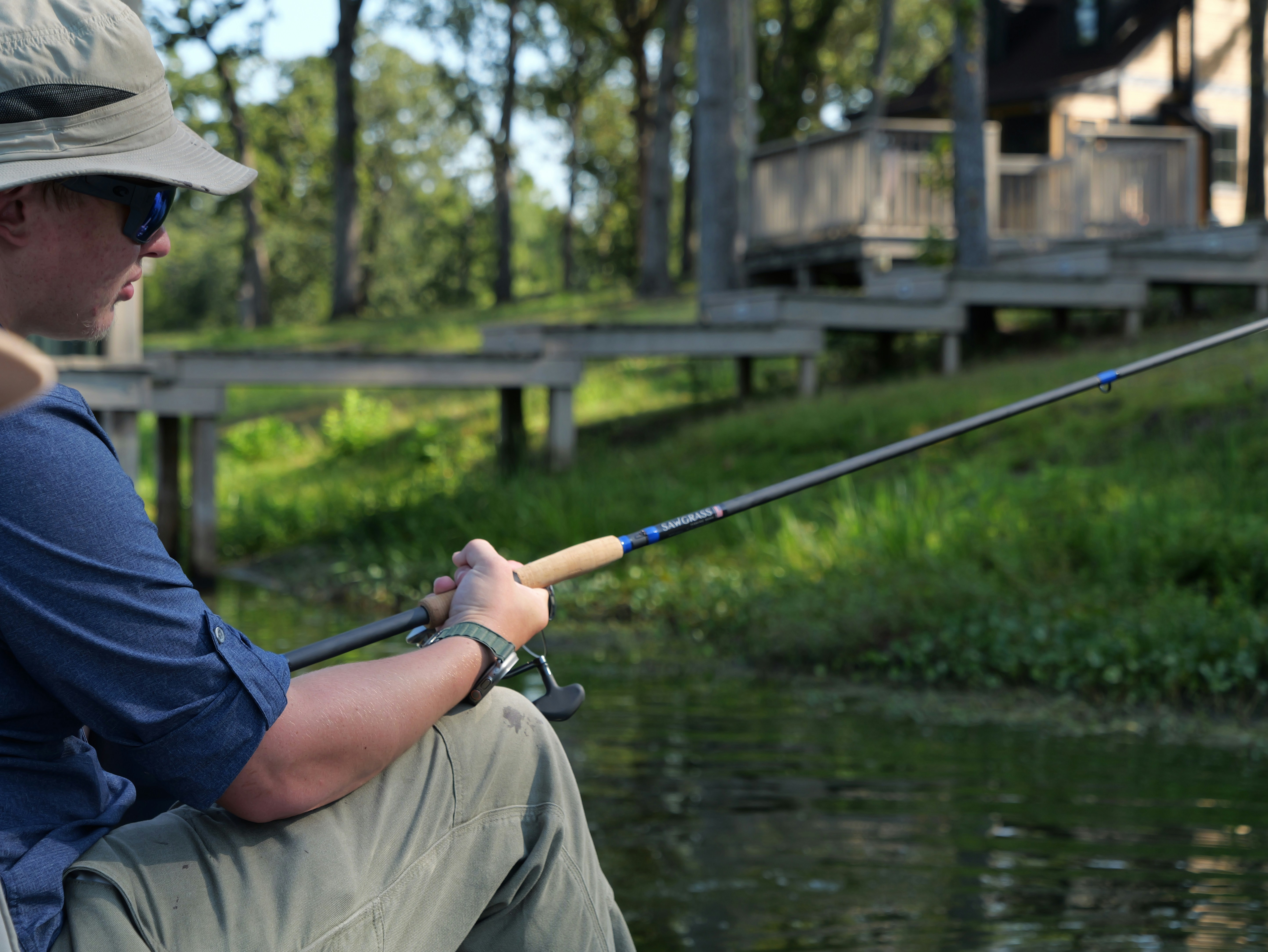 Person fishing from a boat on a lake
