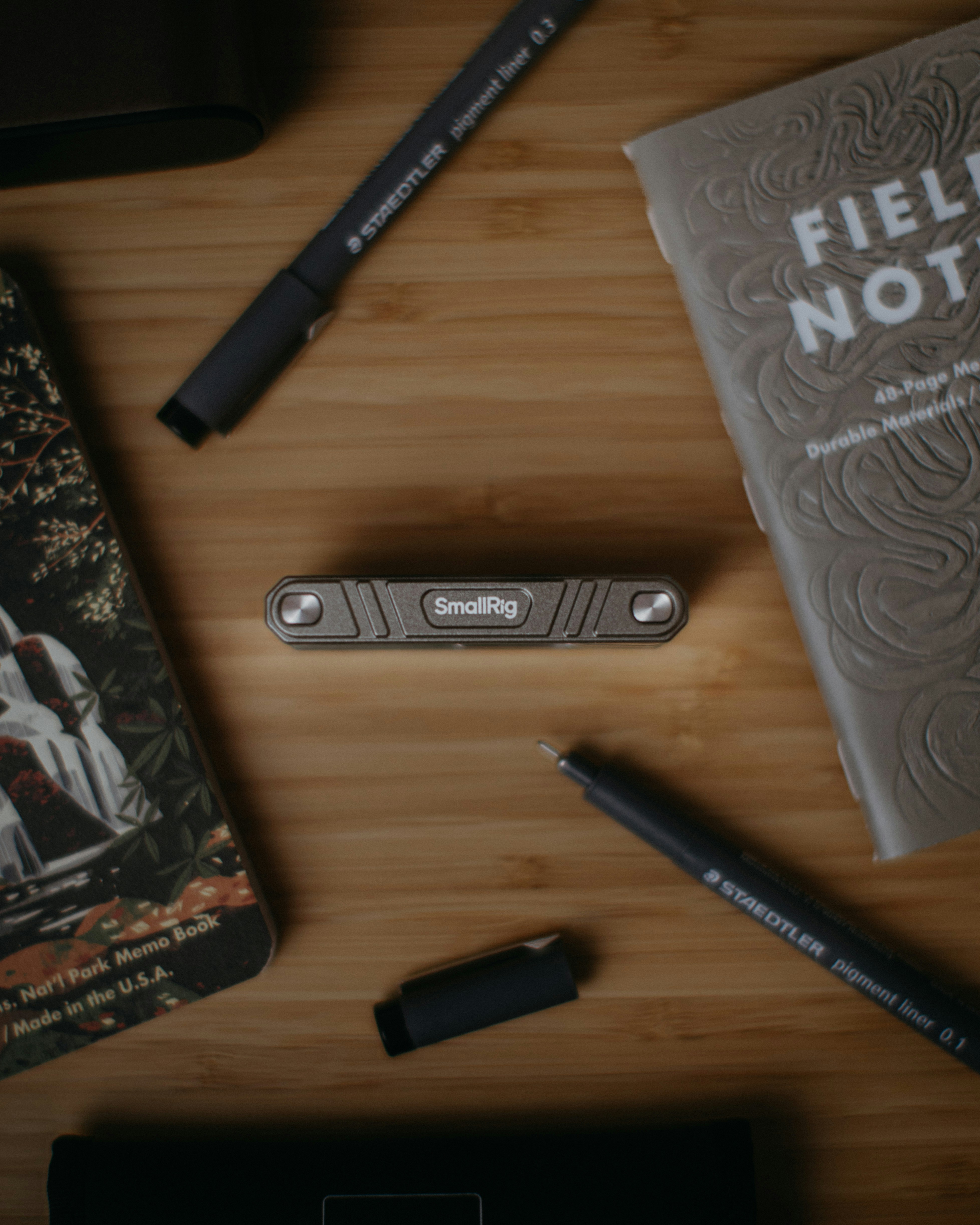 Stationery and small tool arranged on wooden surface