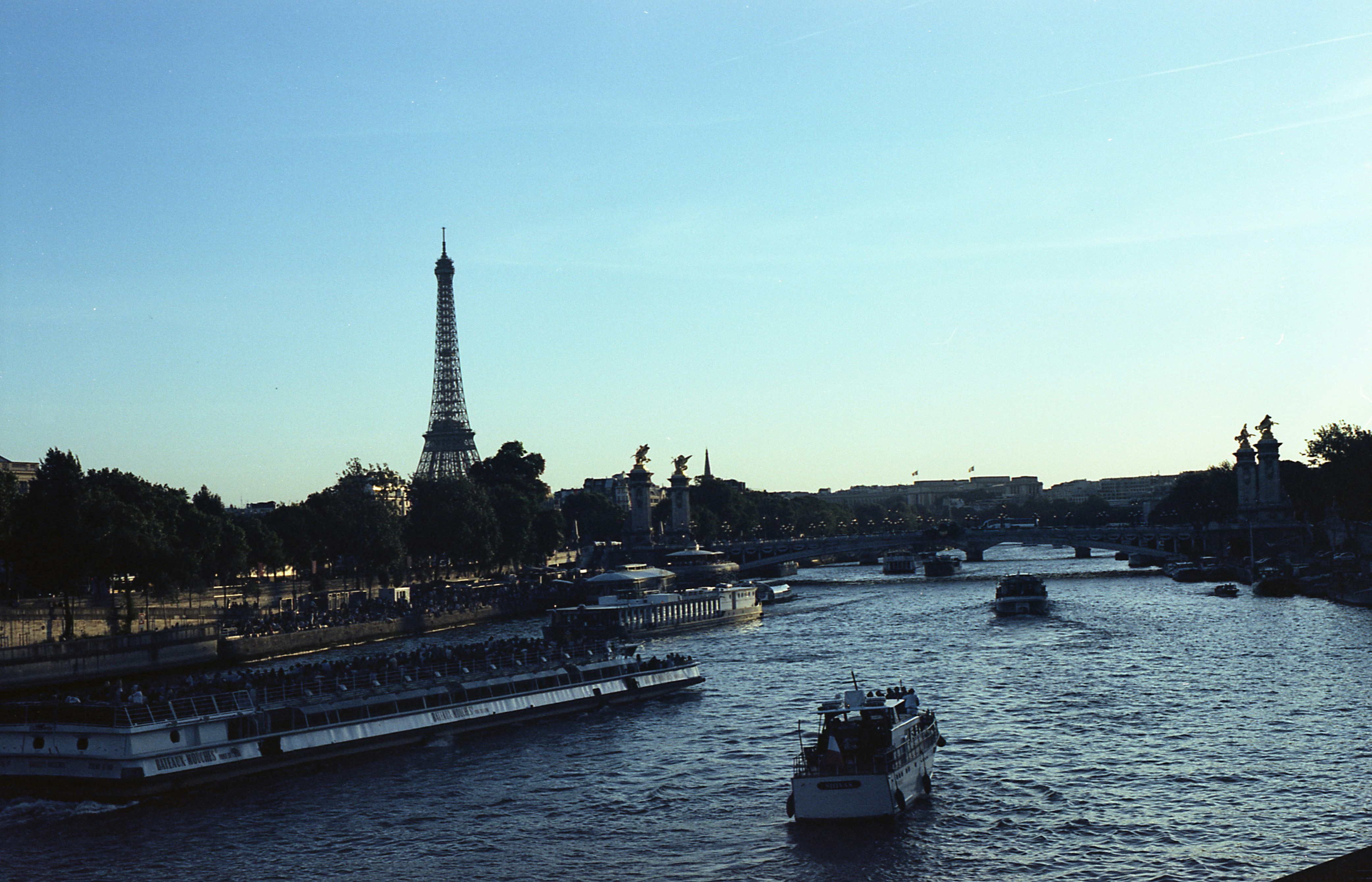 Eiffel tower and boats on the seine river, paris