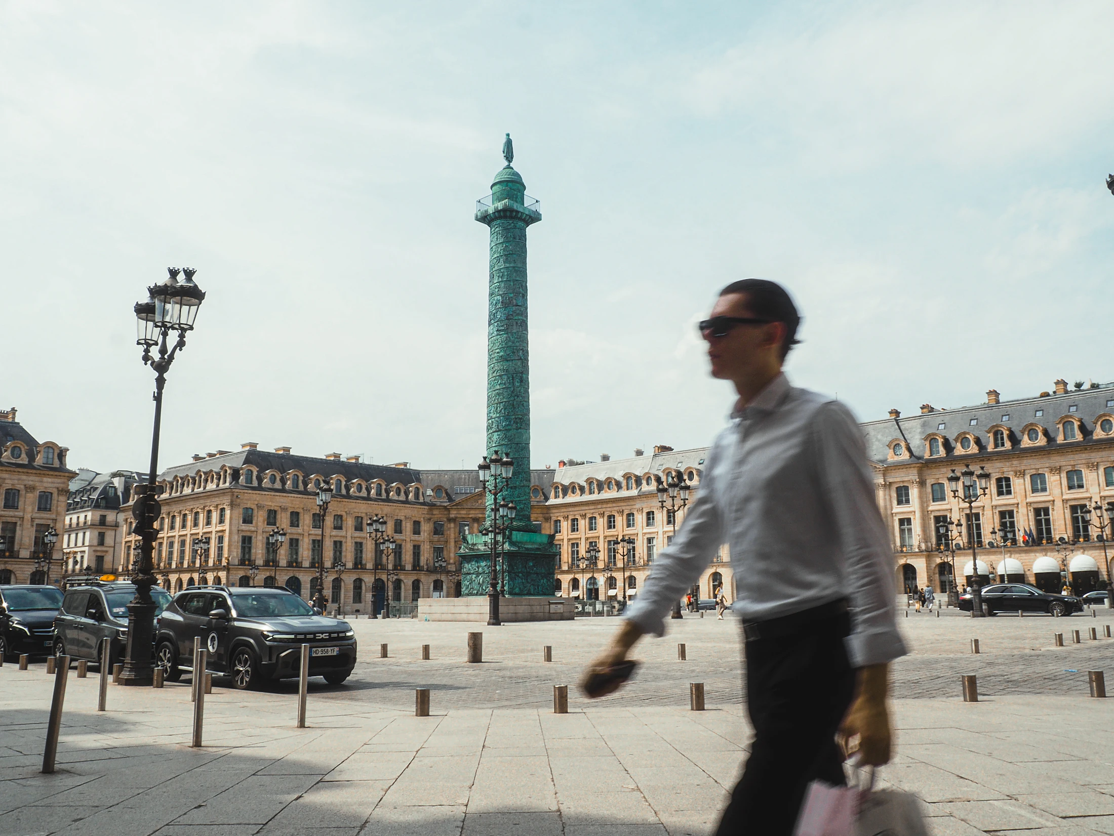 Well-dressed man walking through the elegant streets of Paris