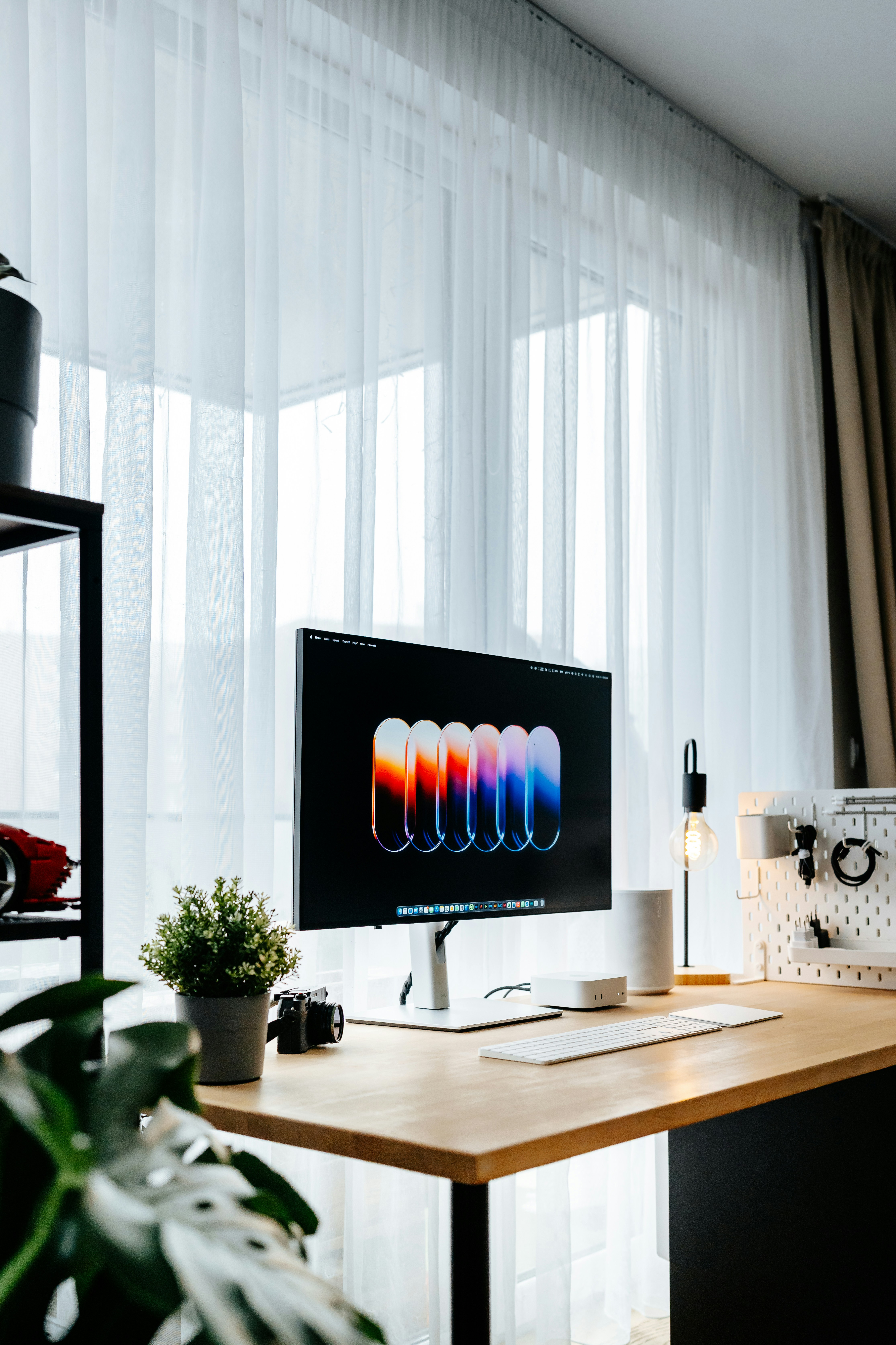Modern desk with computer and plants