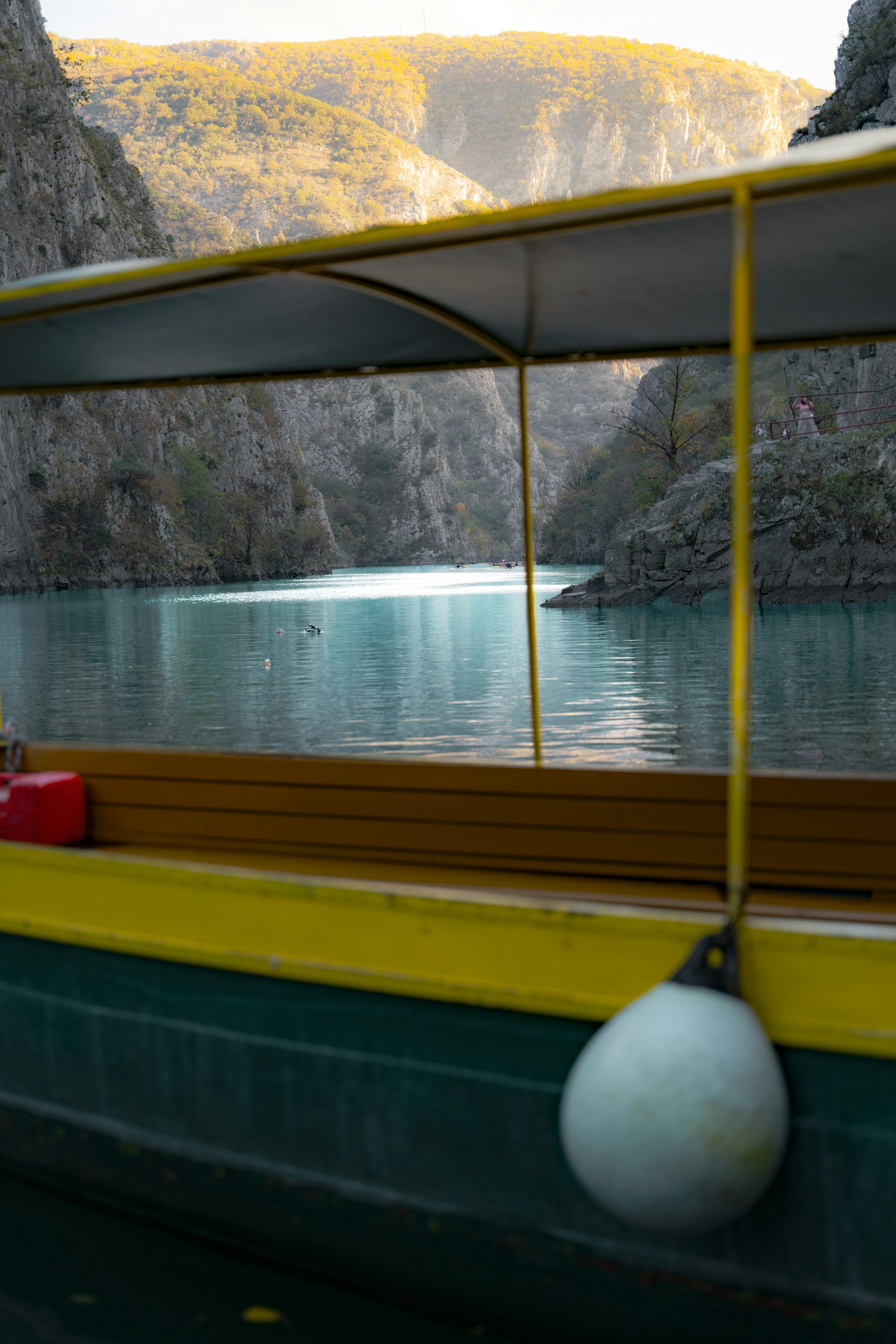 Boat sailing through a scenic mountain gorge