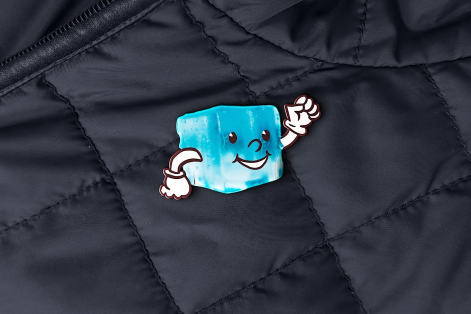 Cartoon ice cube character waving on dark jacket