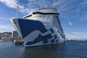 A large cruise ship docked in a harbor
