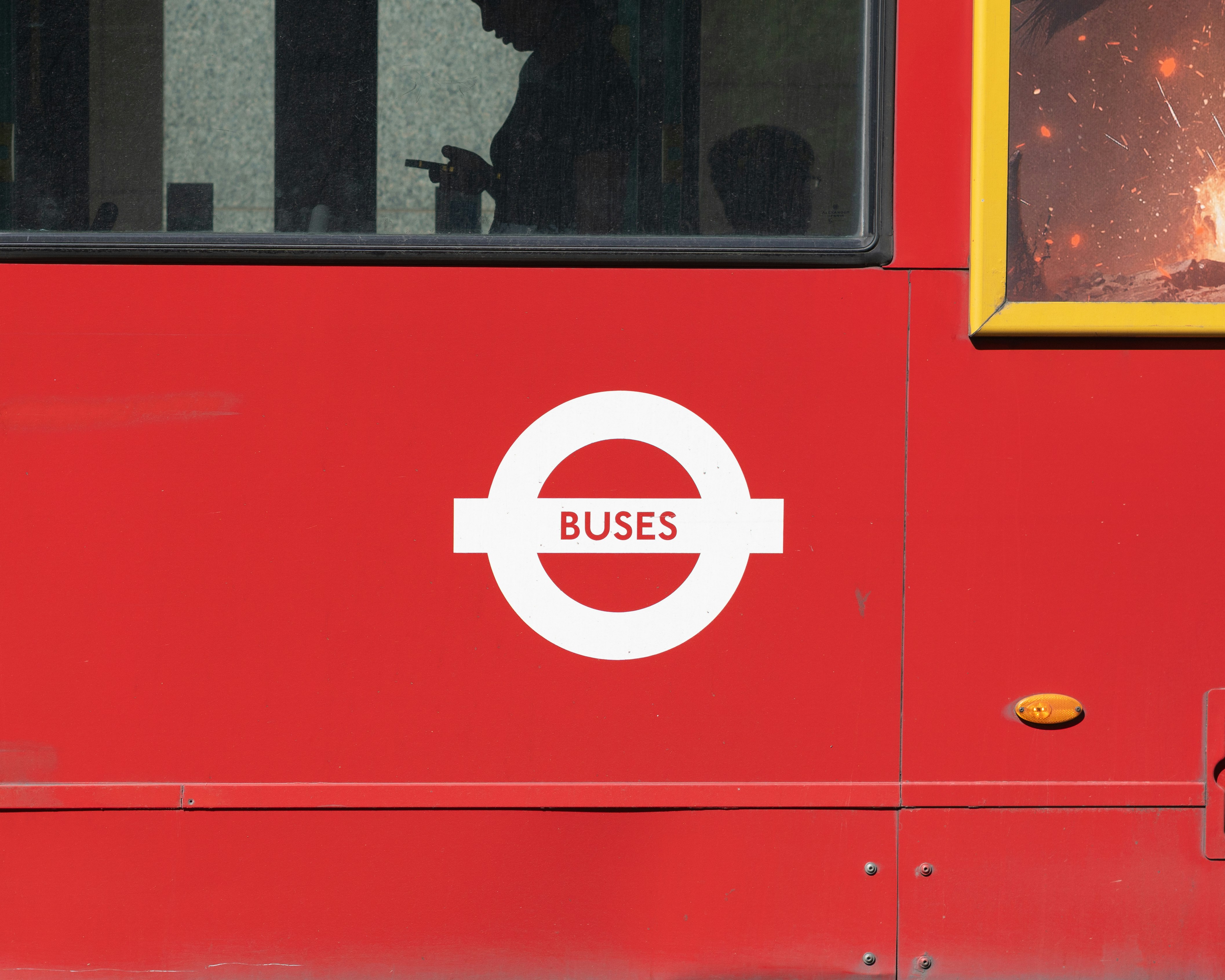 Red london bus with roundel logo