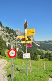 Trail signs in a mountain landscape on a sunny day