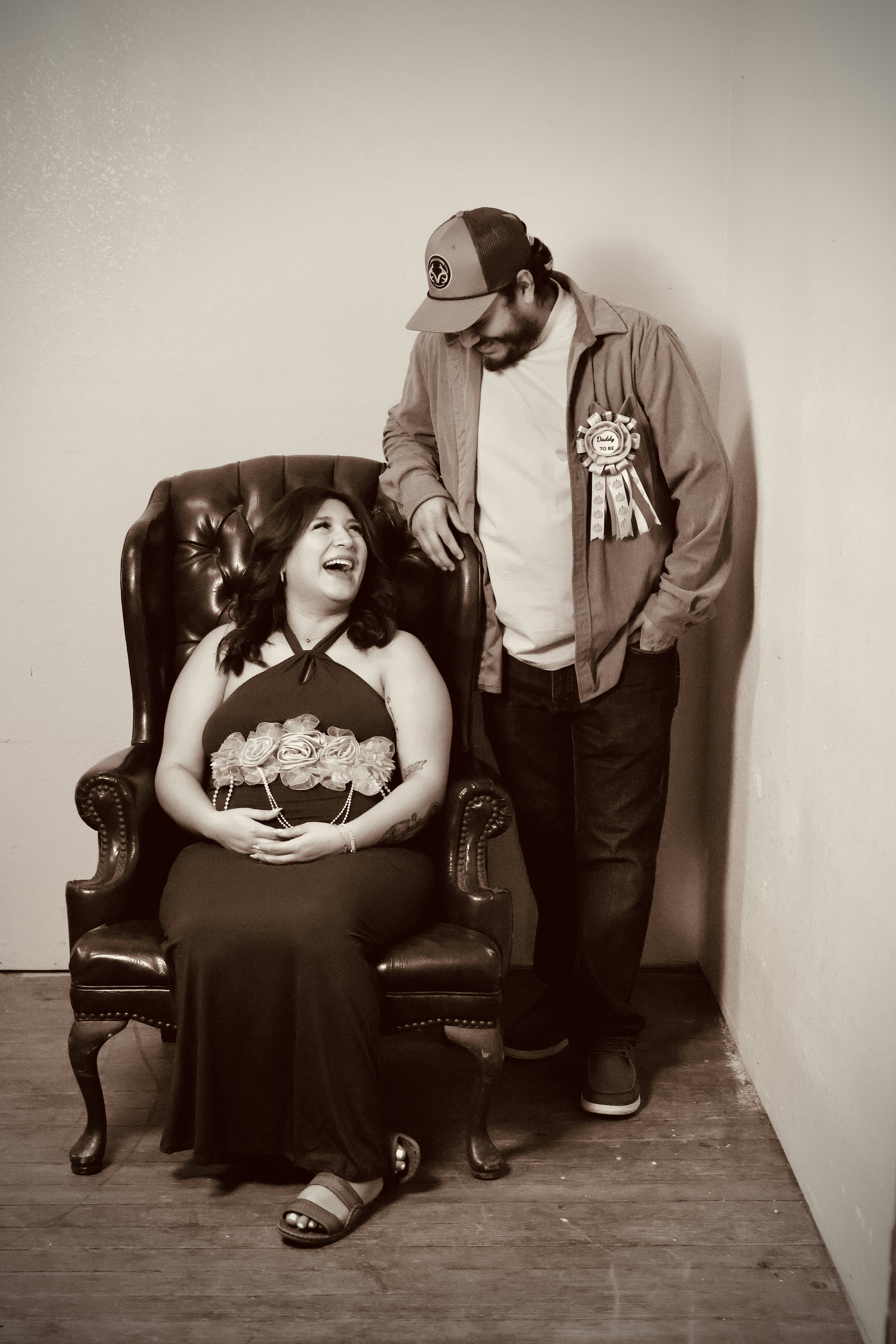 Couple posing for a maternity photoshoot