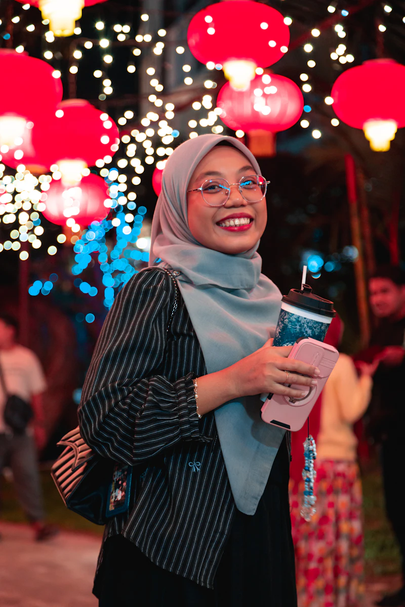 A woman smiling at her phone