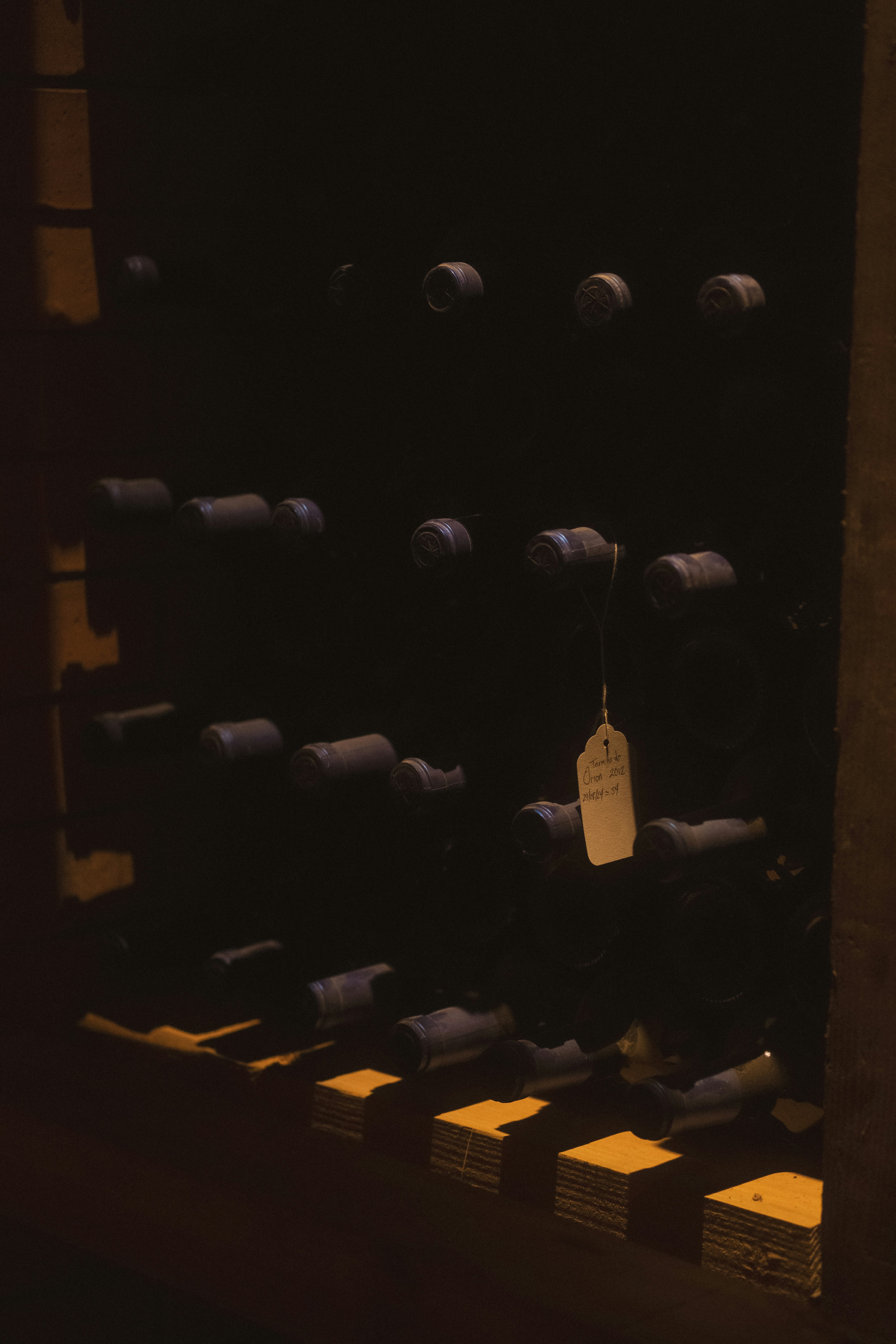 Bottles of wine stored on a rack
