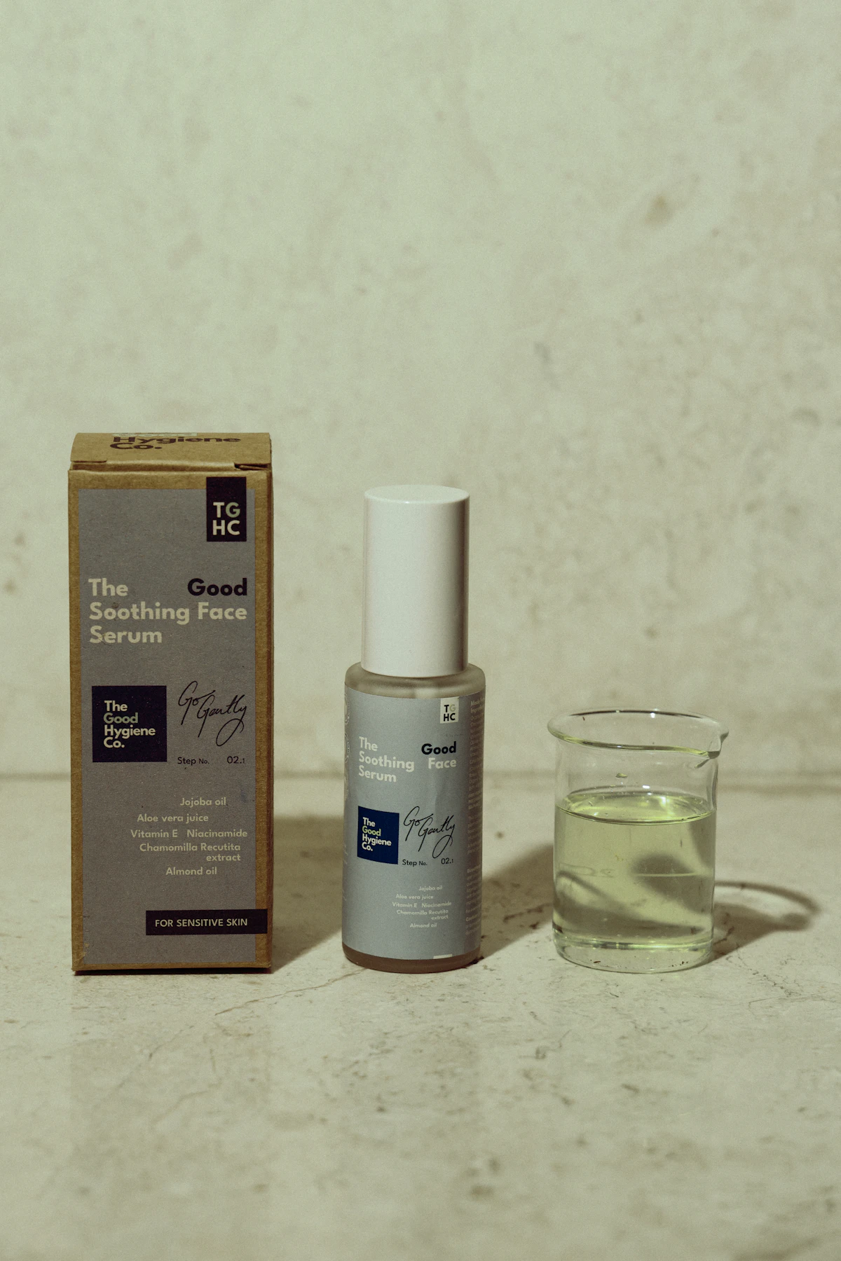 Skincare serum bottle with product packaging