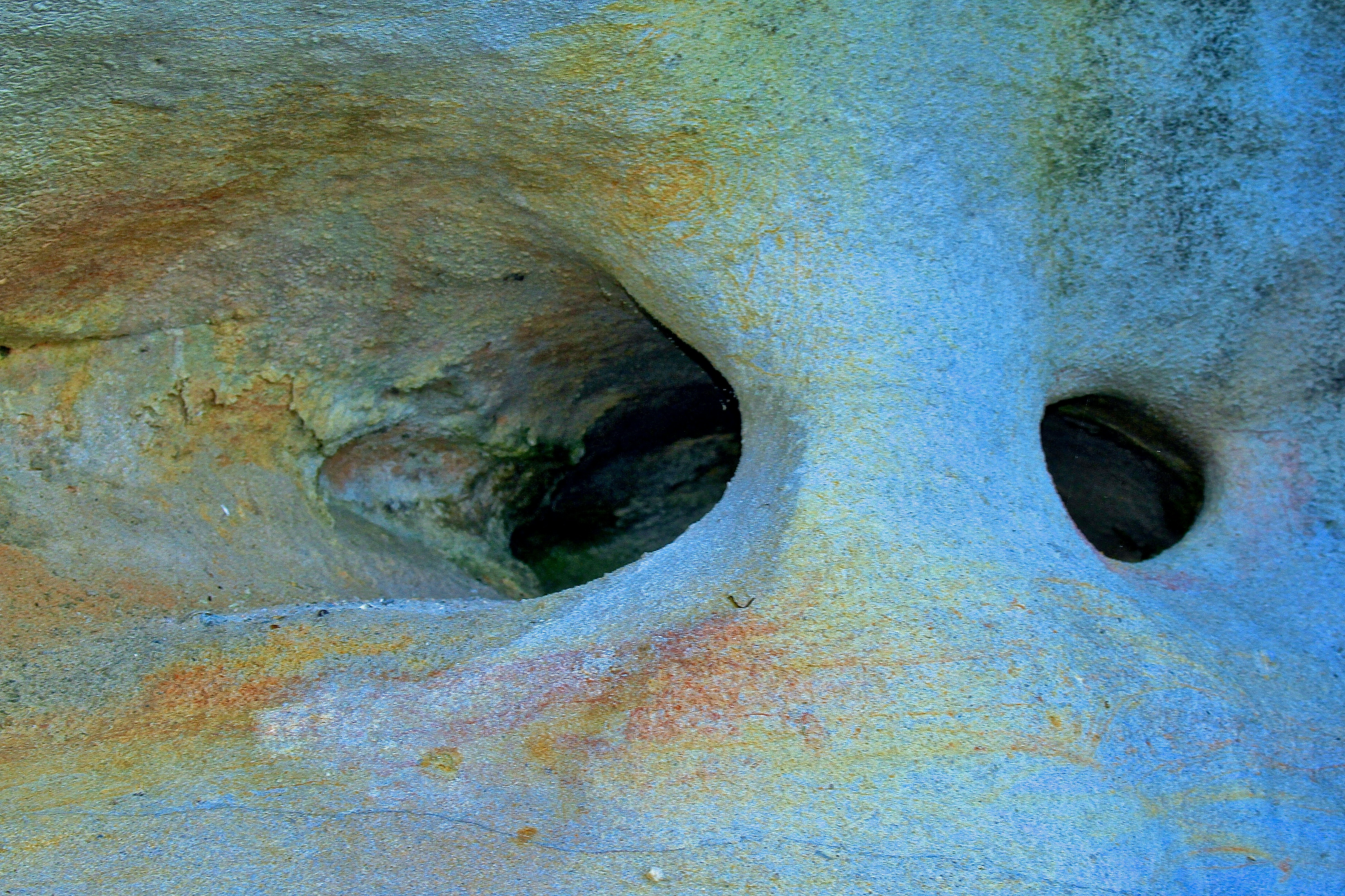 Abstract rock formation with colorful mineral deposits