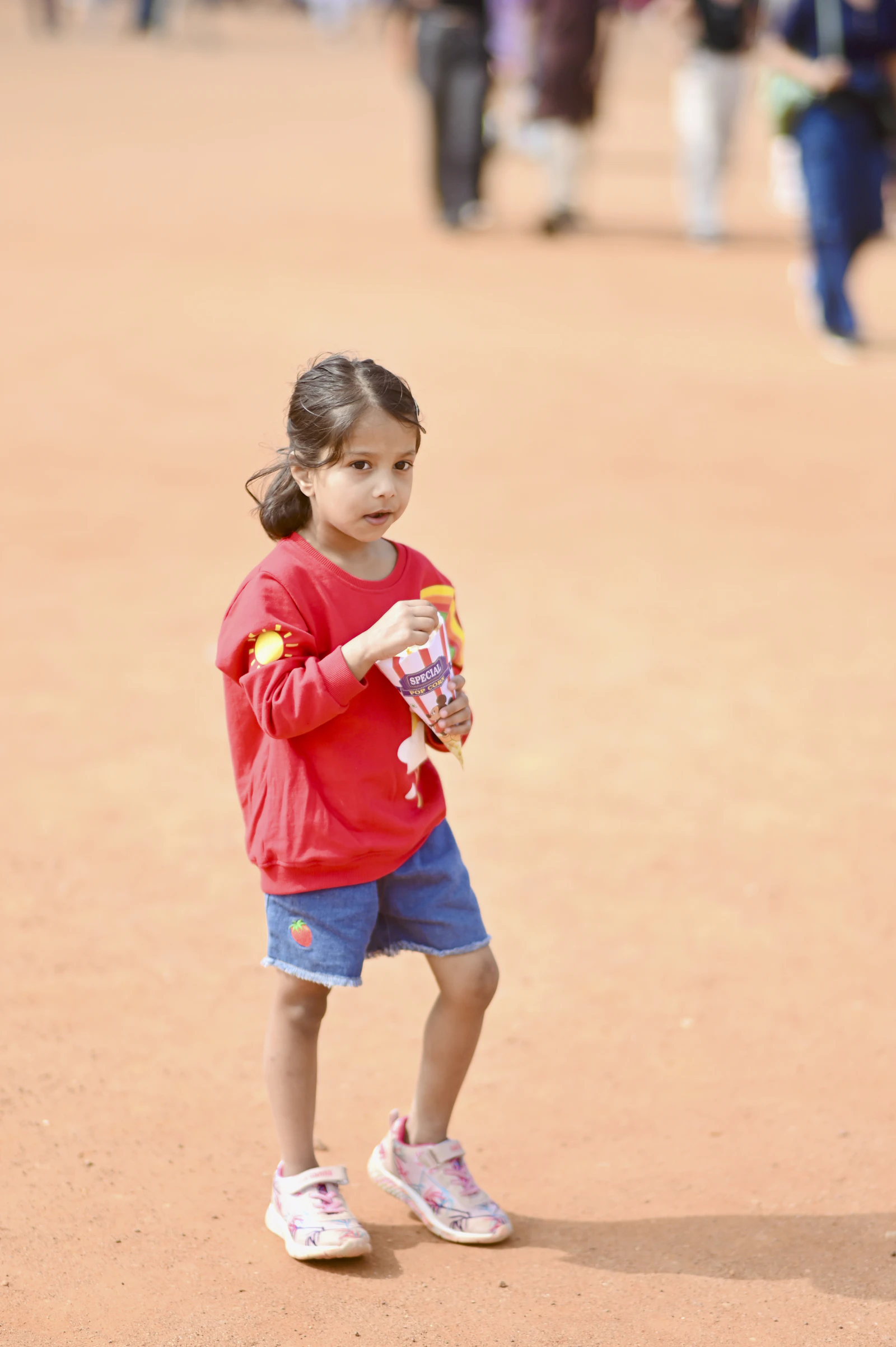 Young girl holding a road trip snack